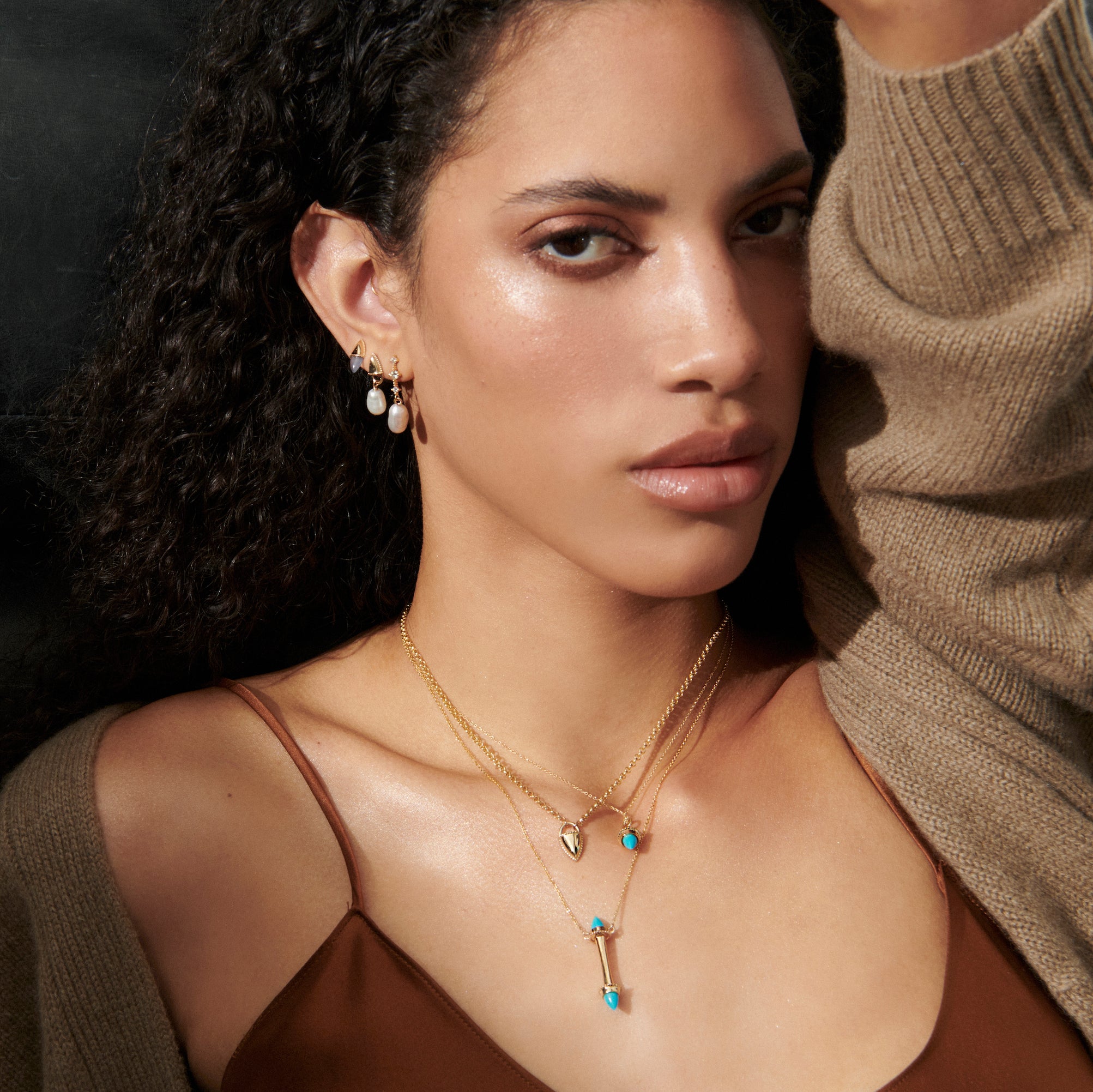 Model wearing the Amphora Scroll Necklace