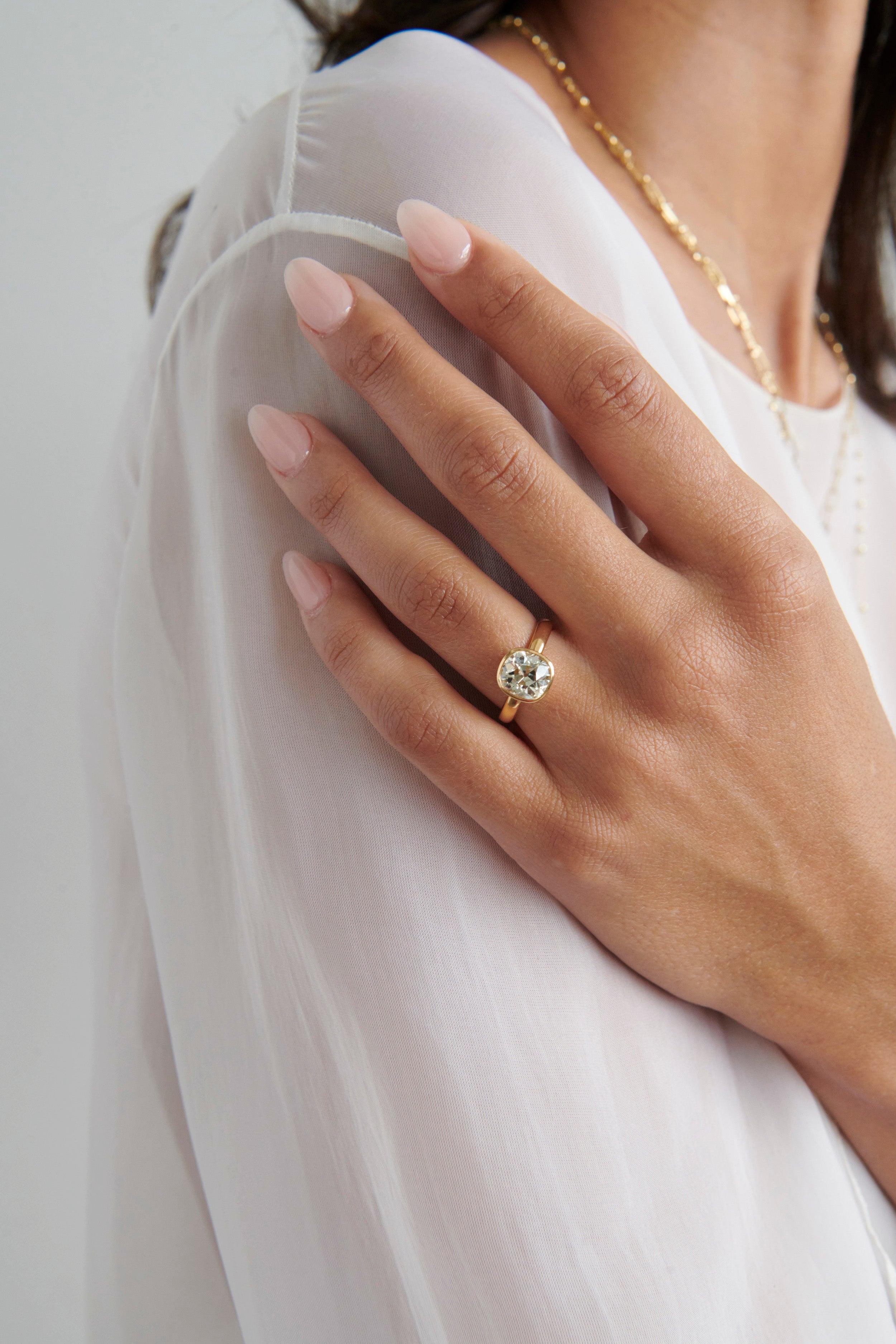 Close-up of Model Wearing Vale Jewelry 2.42 Carat Old Mine Cut Diamond Solitaire Bezel Set Rowan Ring