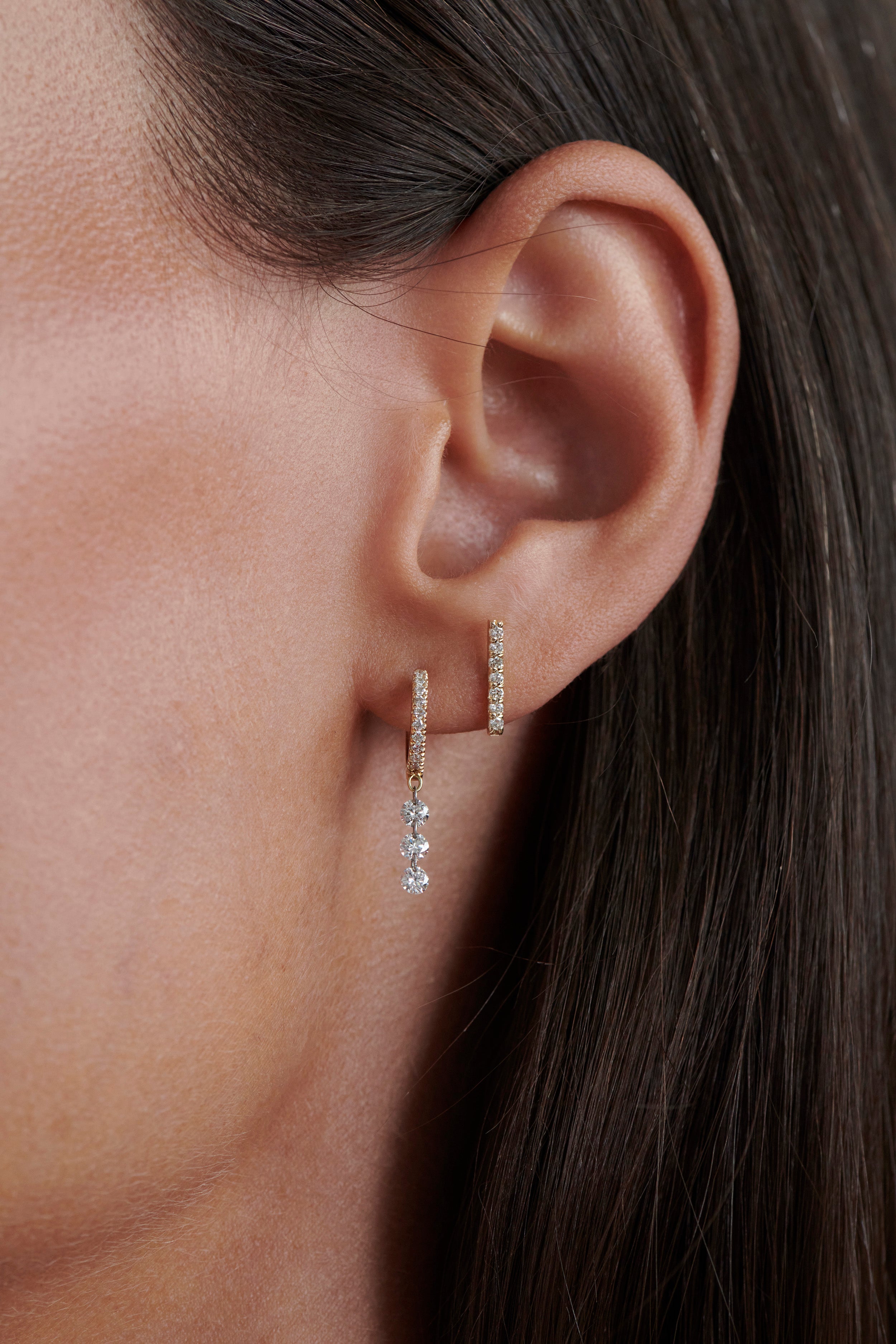 Model Wearing Vale Jewelry 7-Diamond Bar Earrings with Pavé Huggie Earrings with Drilled Diamond Drop