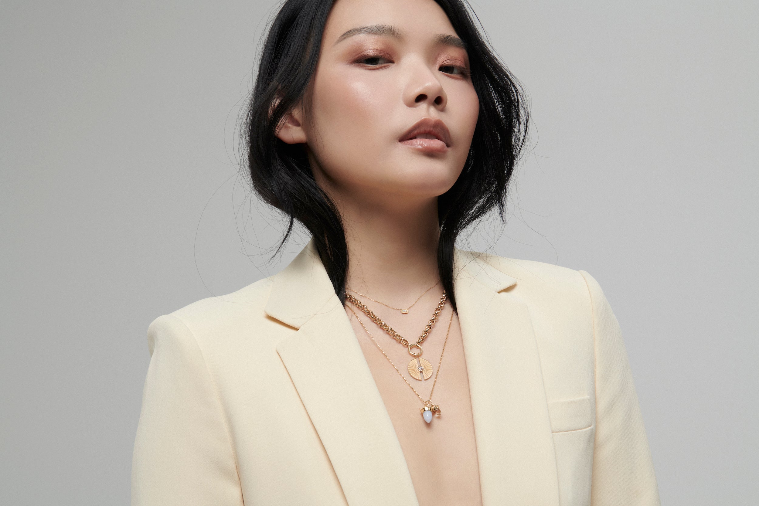 Model Wearing Amphora Amulet with Clear Quartz Charm from Vale Jewelry