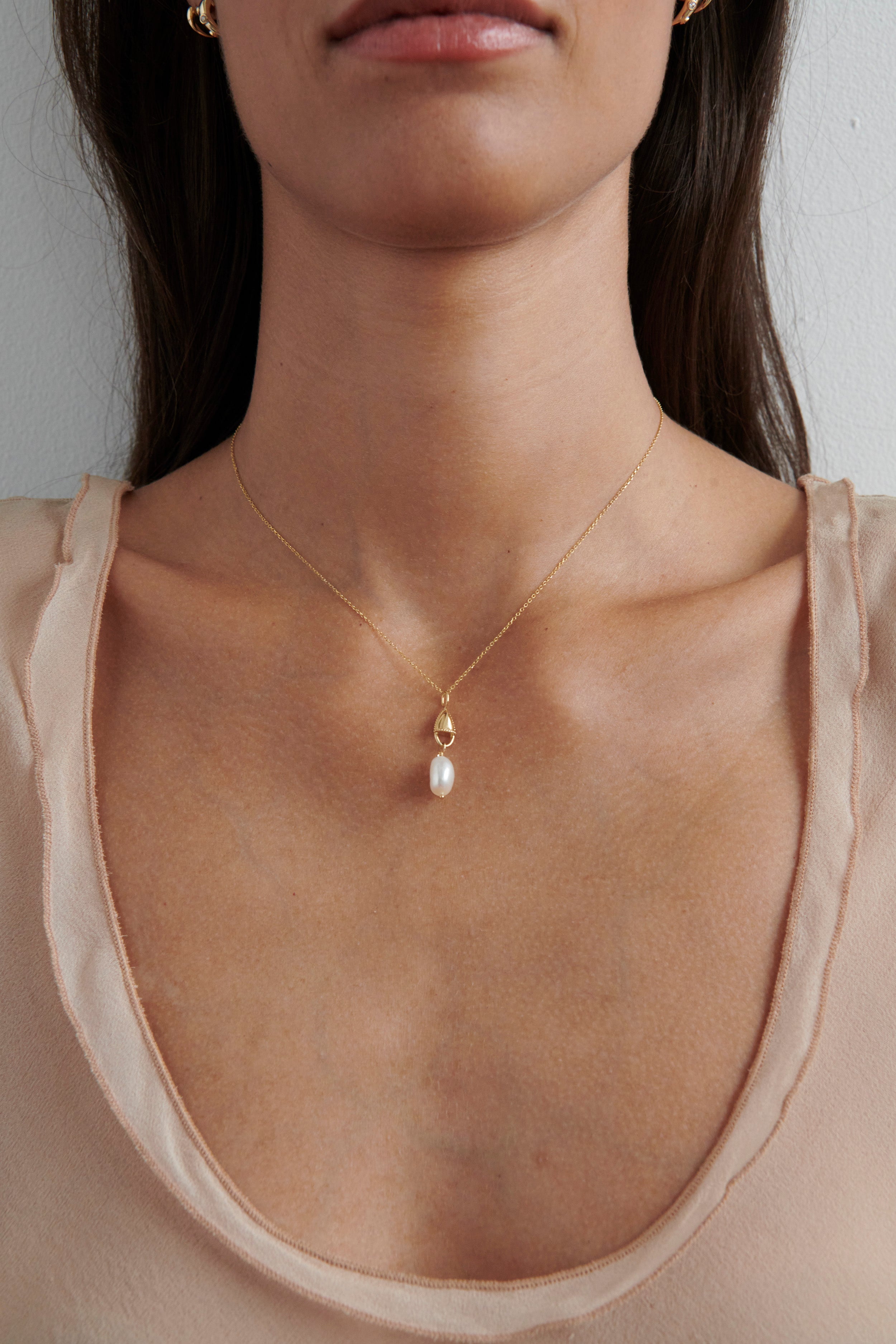 Model Wearing Vale Jewelry Amphora Lock Necklace with Baroque Pearl