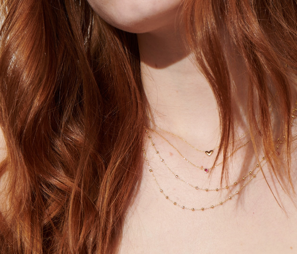 Vale Jewelry Baby Heart Choker On Model with Ruby Barely There and Rosary Necklace