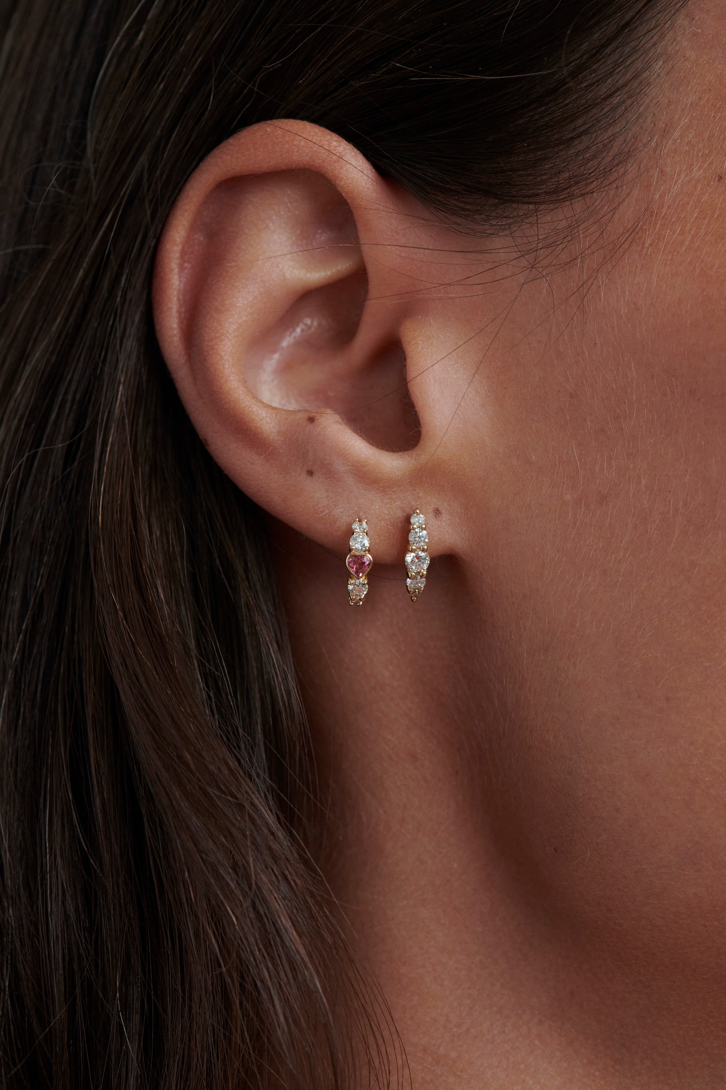 Close-up of Model Wearing Vale Jewelry Half Hoop Heart & Diamond Earrings and Belle du Jour with White Diamonds
