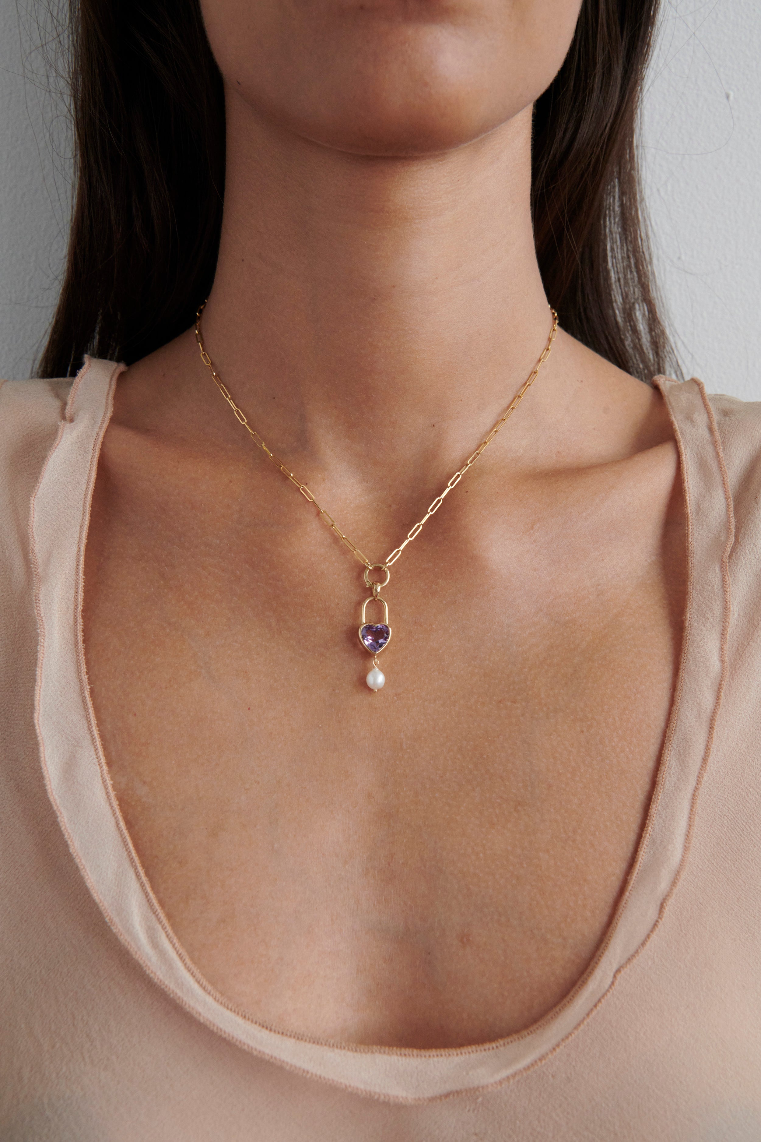 Close-up of Model Wearing Vale Jewelry Large Heart Lock with Baroque Pearl on Charm Clip Necklace