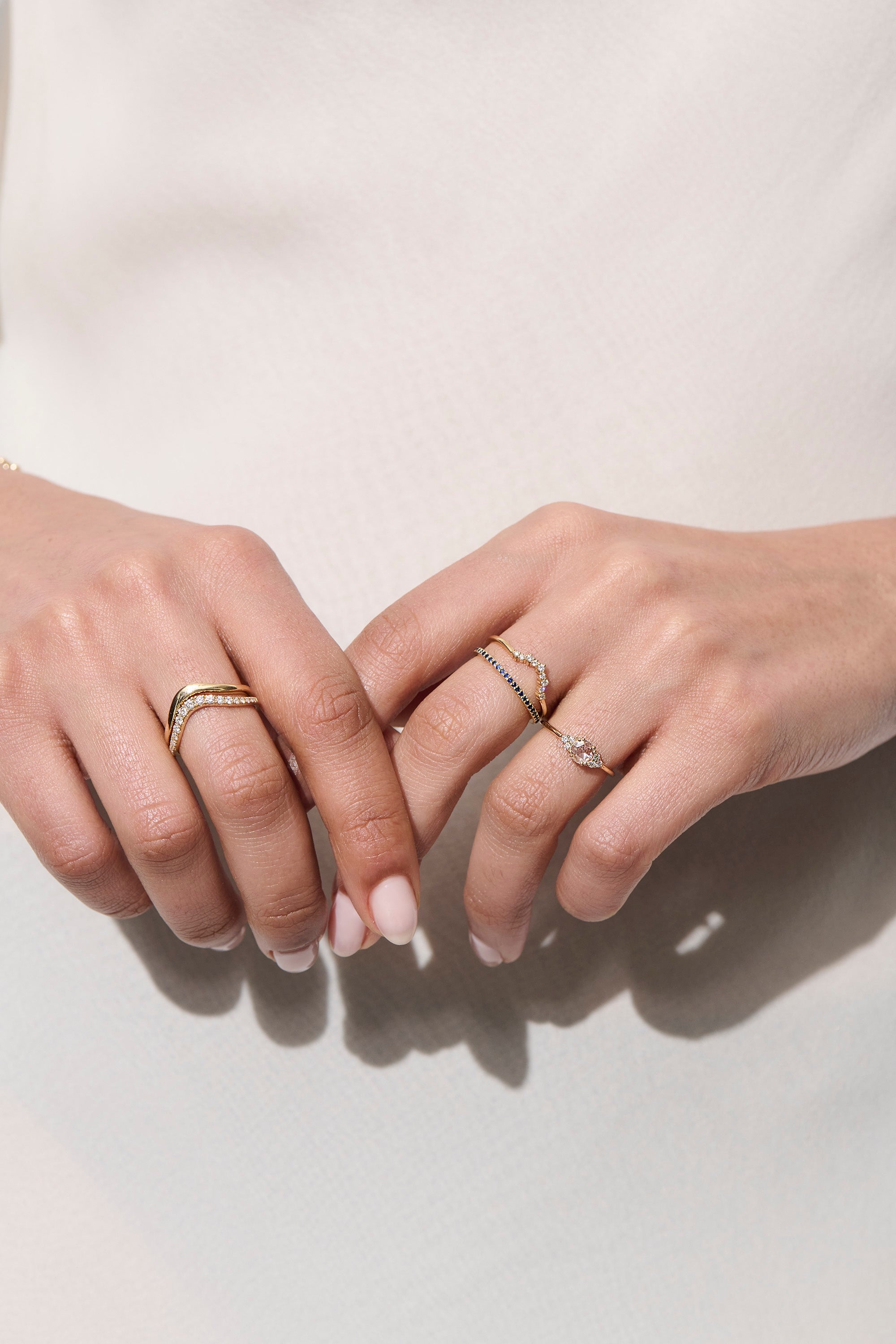 Model Wearing Vale Jewelry Lune Ring with Rose Cut Diamond and Other Diamond Rings