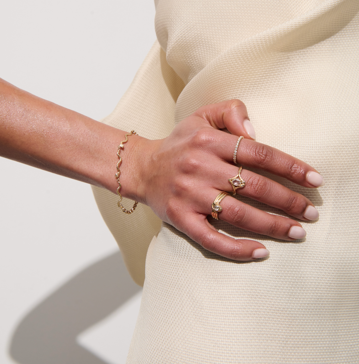 Model's Hand Wearing Vale Jewelry Nelle Ring with White Diamonds in Yellow Gold