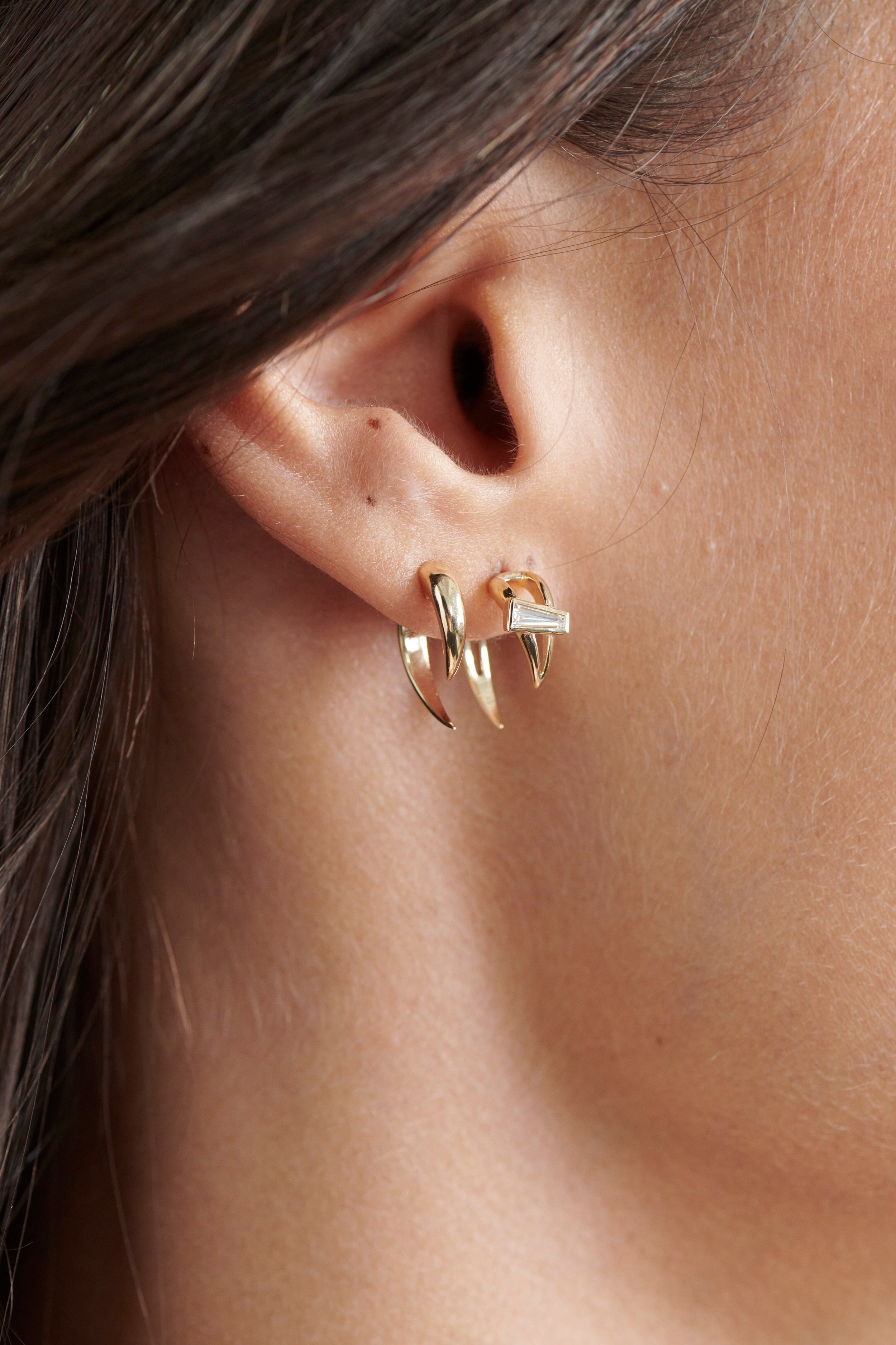 Close-up of Model Wearing Vale Jewelry Open Swoop Tapered Baguette Cut Diamond 2-Piece Earrings
