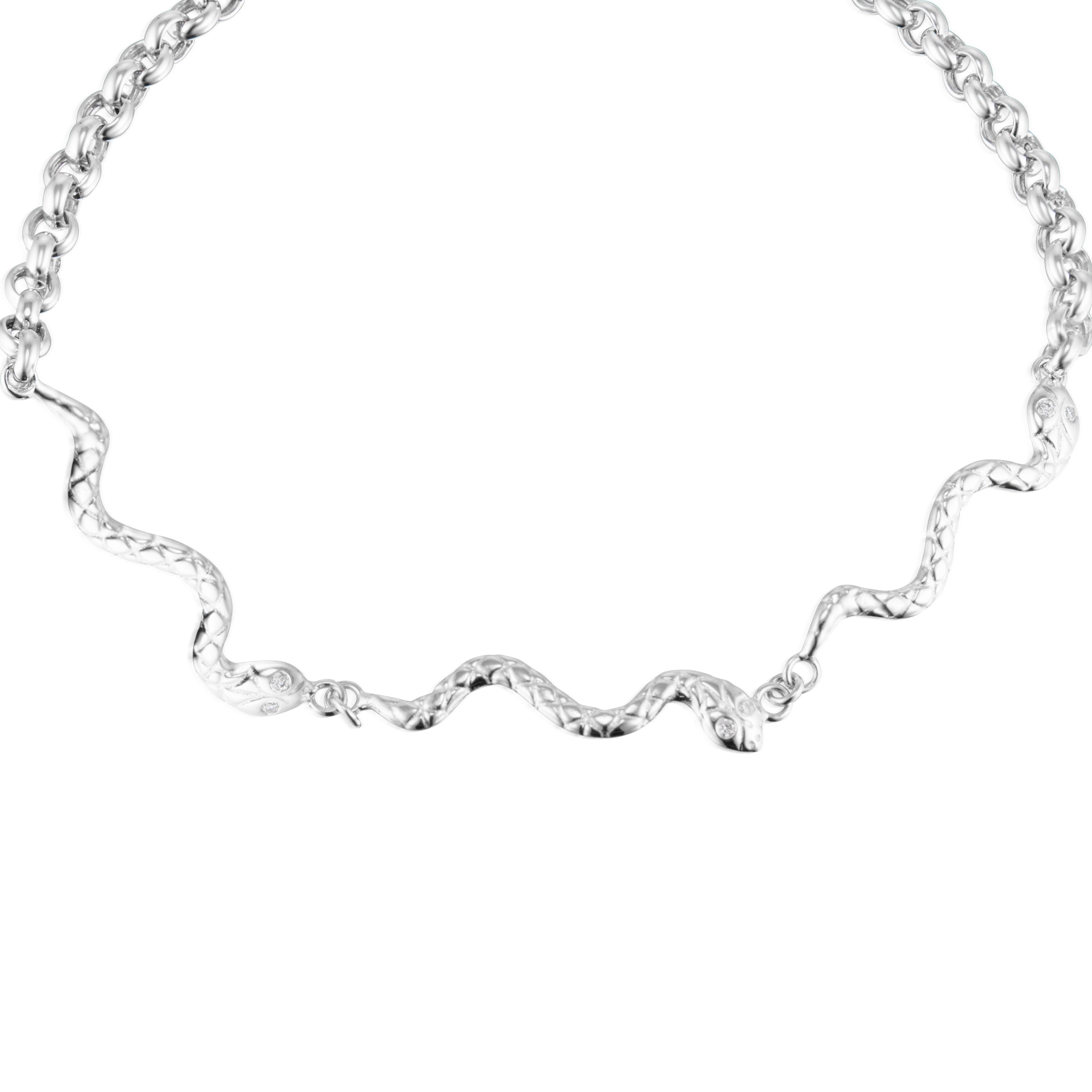 Alt="Vale Jewelry close up of textured serpents bracelet with three snakes in white gold"