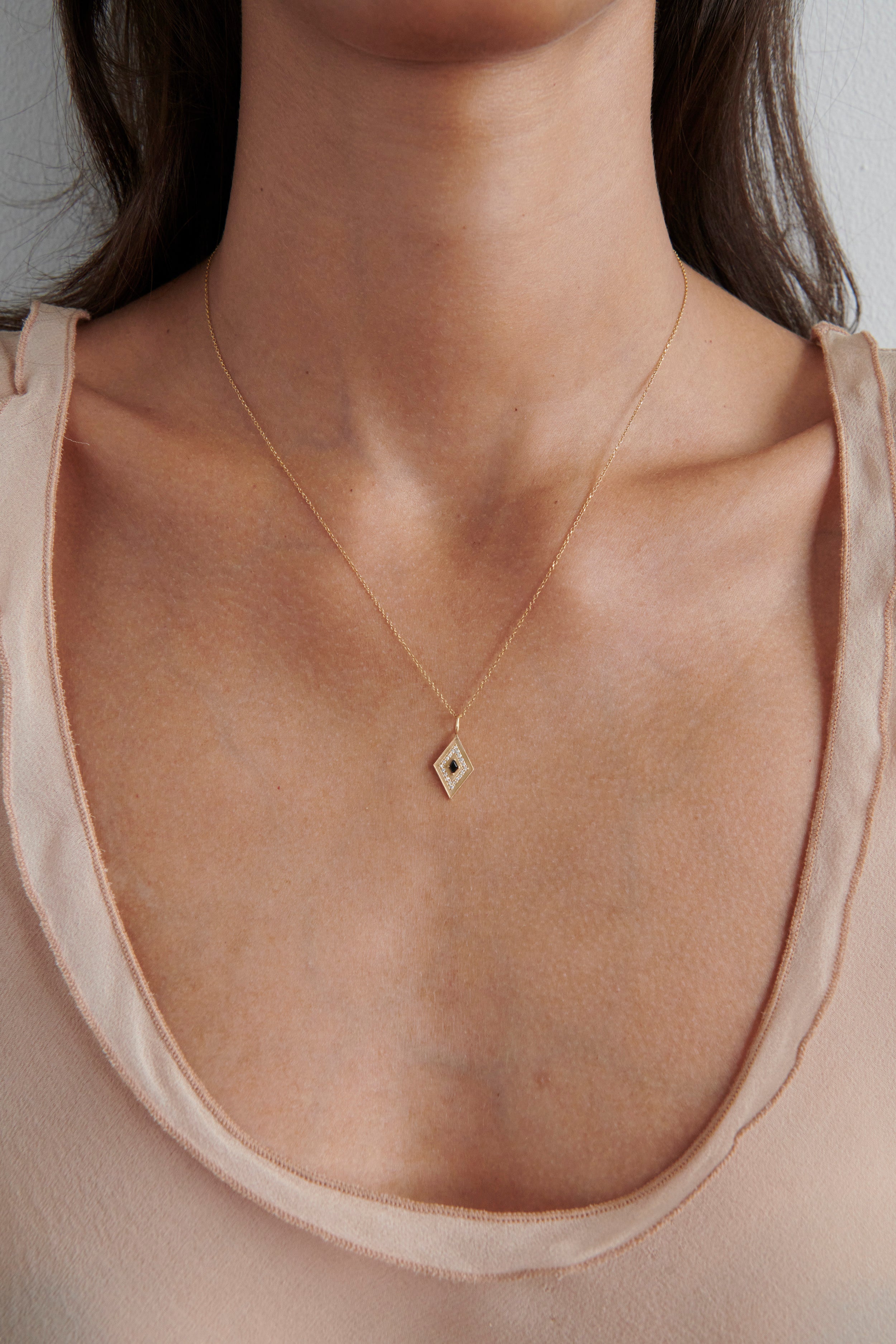 Close-up of Model Wearing Vale Jewelry Theodora Amulet Necklace
