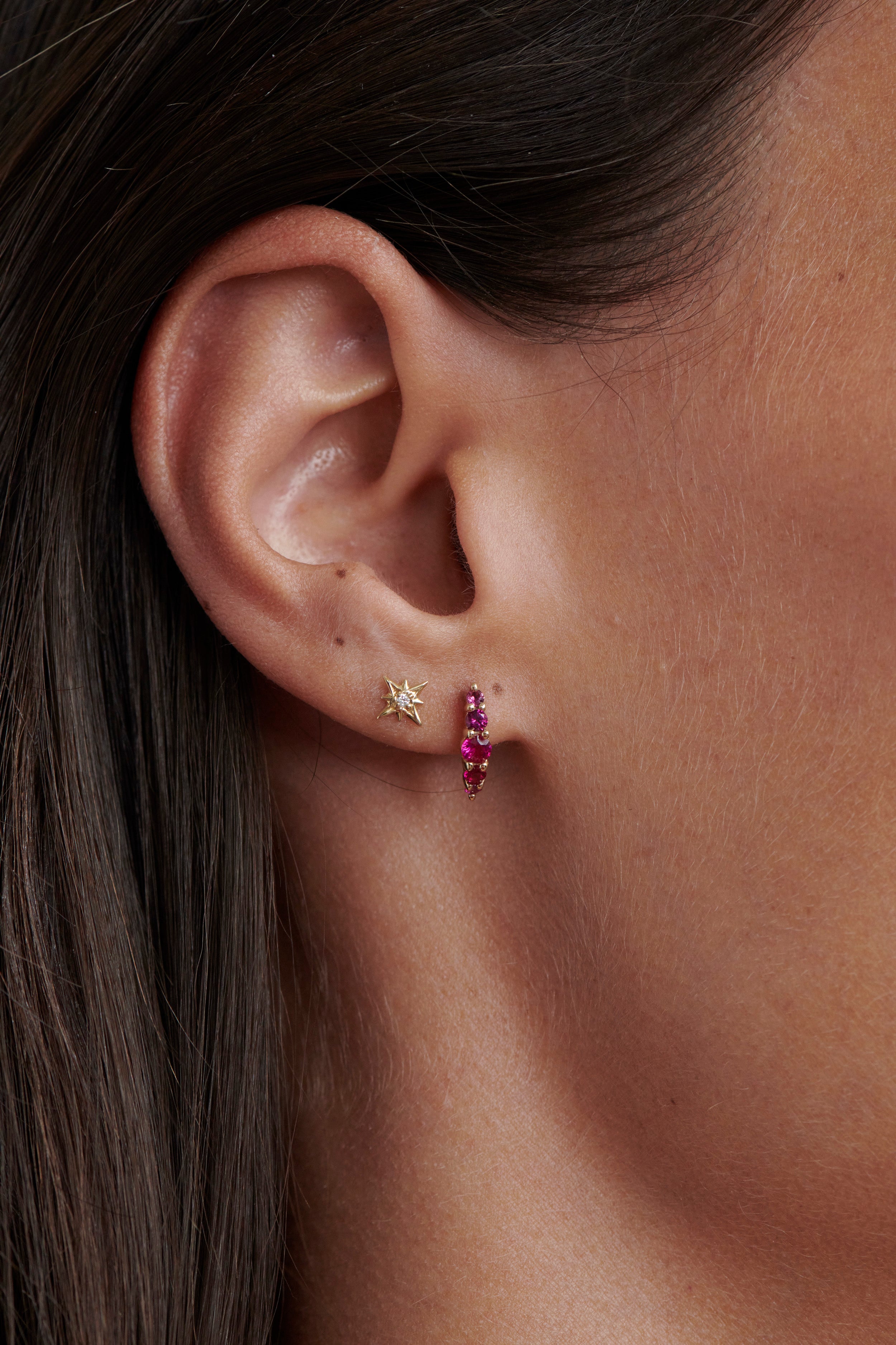 Close-up of Model Wearing Vale Jewelry Tiny Supernova Earrings and Belle du Jour Earrings with Rubies