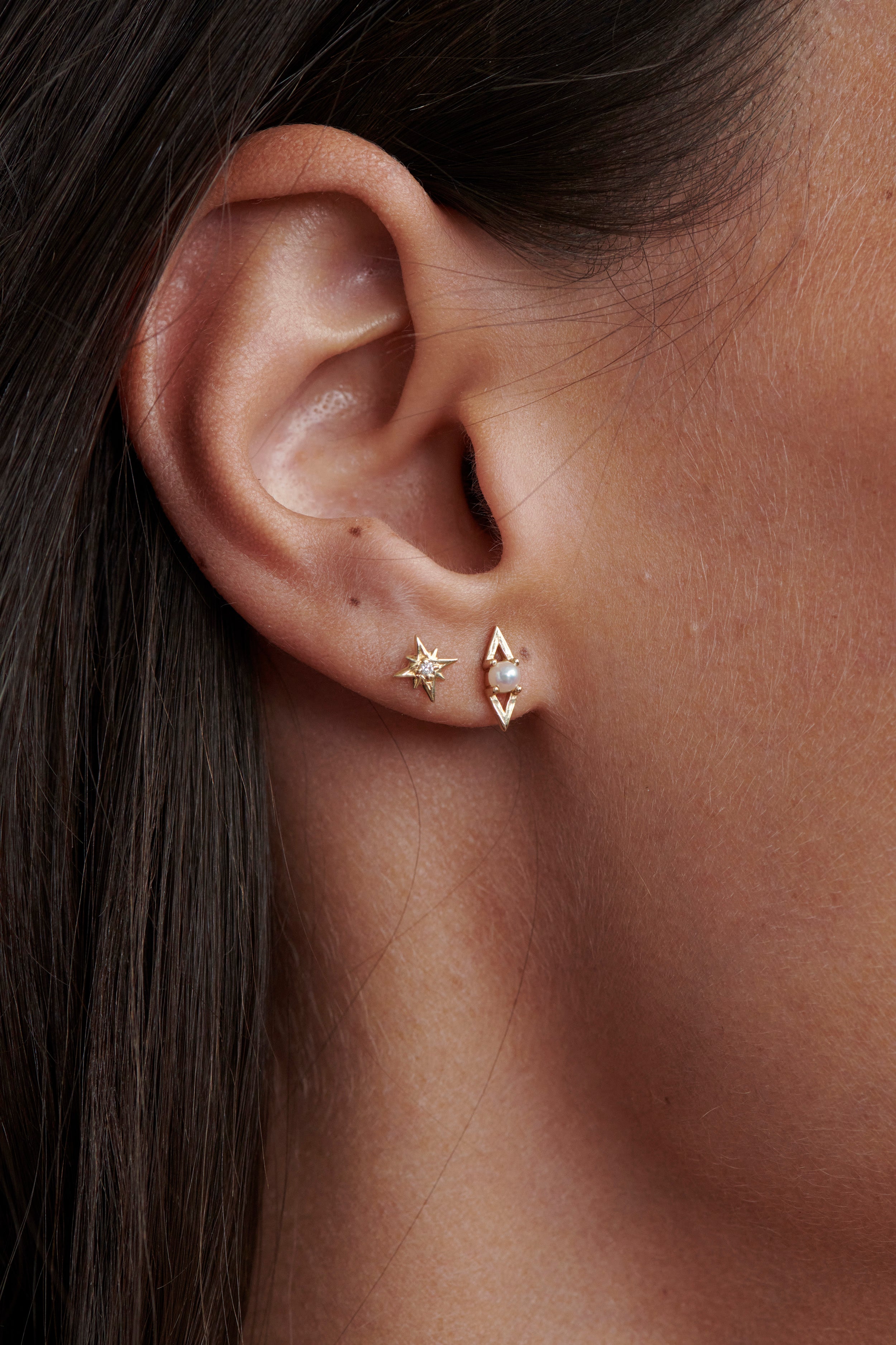 Close-up of Model Wearing Vale Jewelry Tiny Supernova Earrings and Victoire Earrings with Pearl