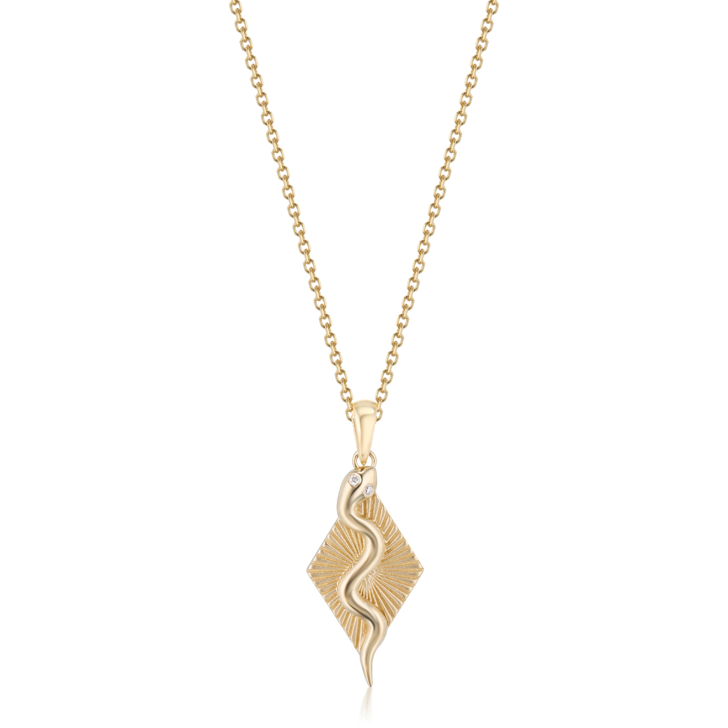 Yellow gold serpent ray necklace on a white background