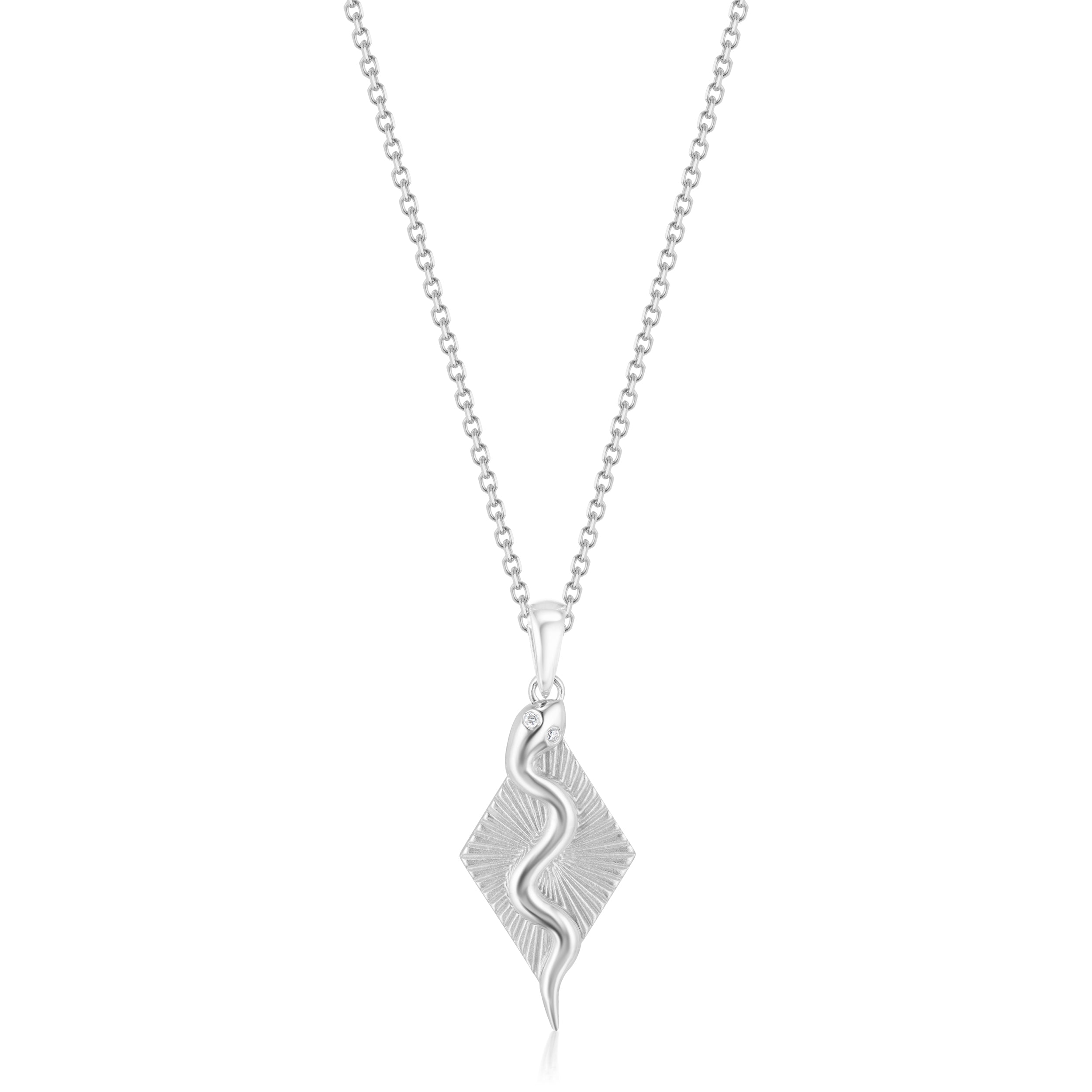Alt="Vale Jewelry White gold serpent ray necklace close up on a white background"