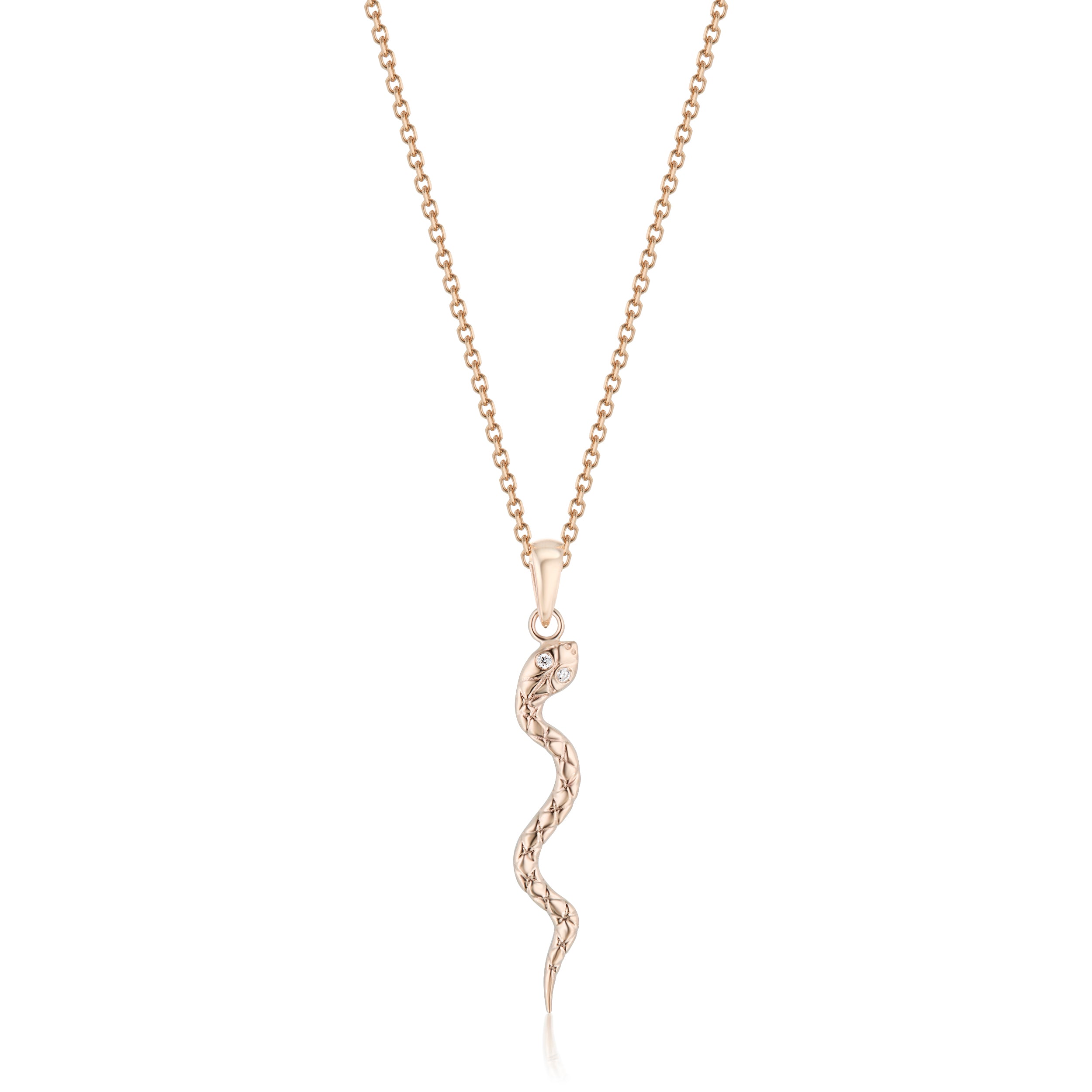 Rose gold textured serpent pendant necklace on plain backdrop
