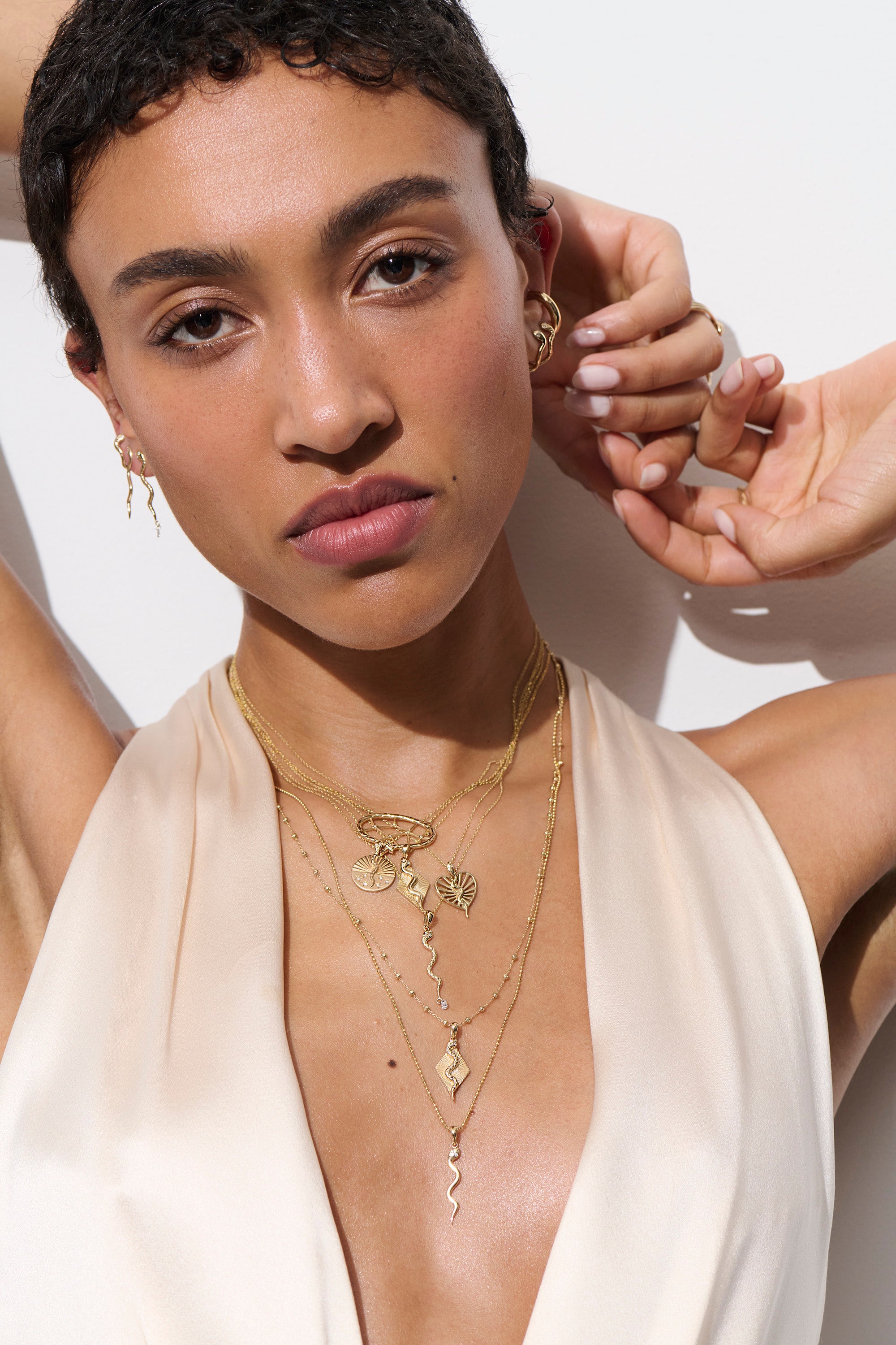 Alt="Vale Jewelry Model wearing textured serpent necklace, textured serpent ray necklace with other jewelry"