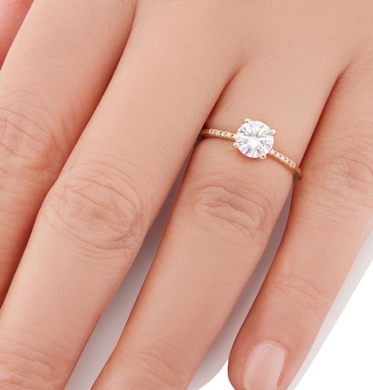 Vale Jewelry Estee Ring with 1.00 carat Brilliant Cut White Diamond and White Diamond Pave Accents in 14 Karat Yellow Gold Hand View