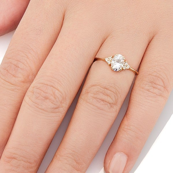Vale Jewelry Juno Ring with White Brilliant Cut Oval Diamond Center and White Diamond Accents in 14 Karat Yellow Gold Hand View