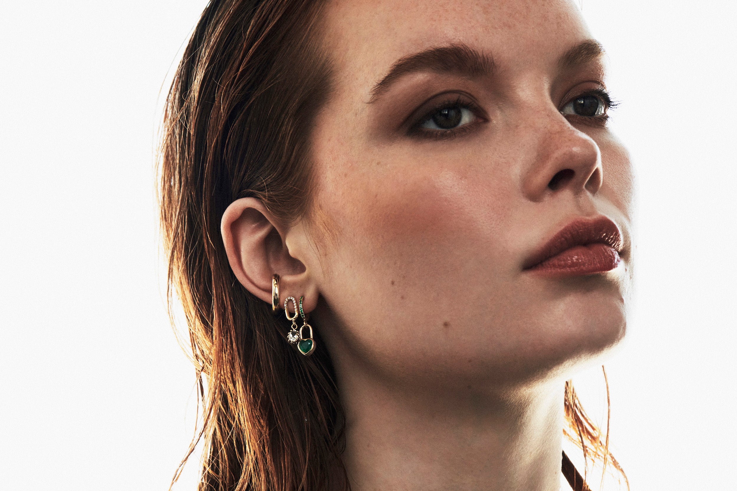 Model wearing earrings from Vale Jewelry