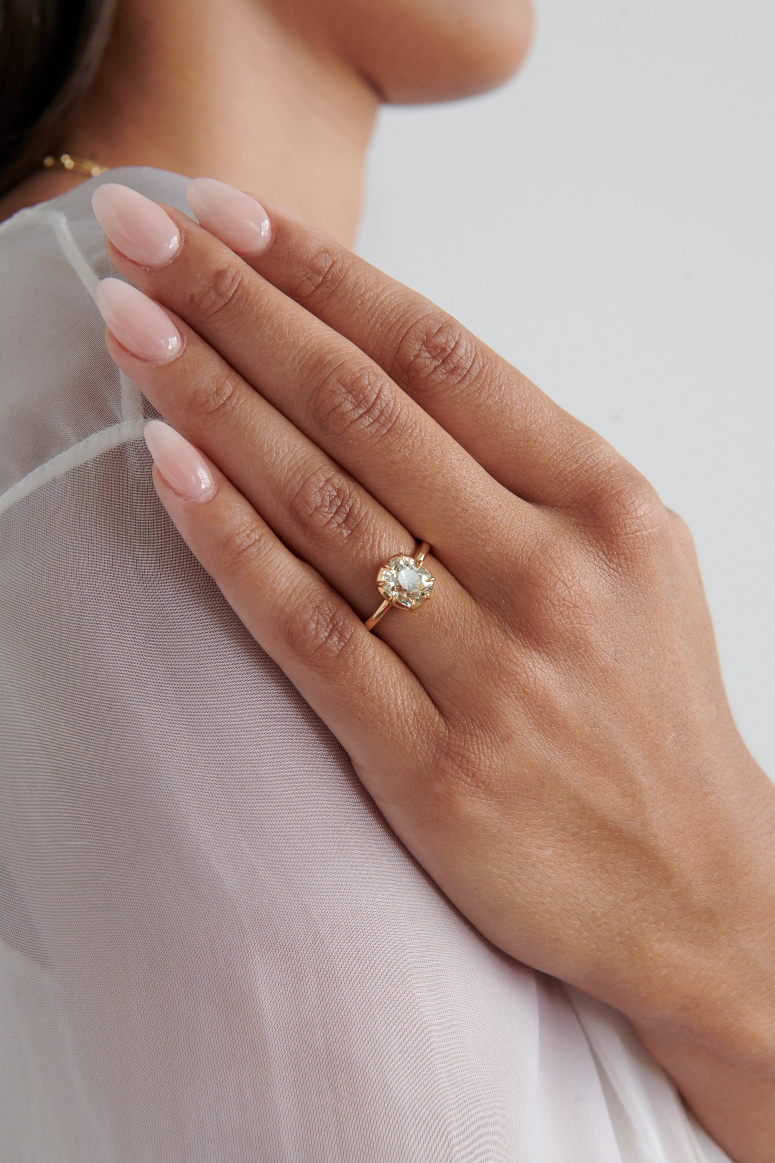 Hand Model Wearing Vale Jewelry 2.65 Carat Cushion Diamond Zoe Ring in 18K Yellow Gold Collet Setting