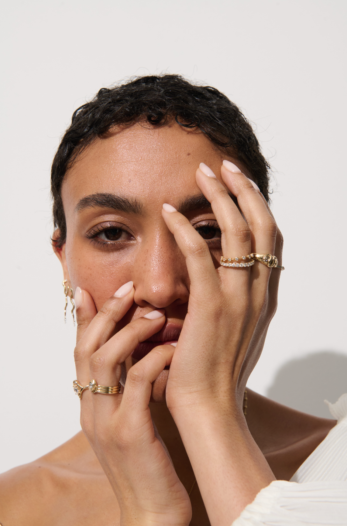 Model wearing a stack of rings, including the Vale Jewelry Allie Ring