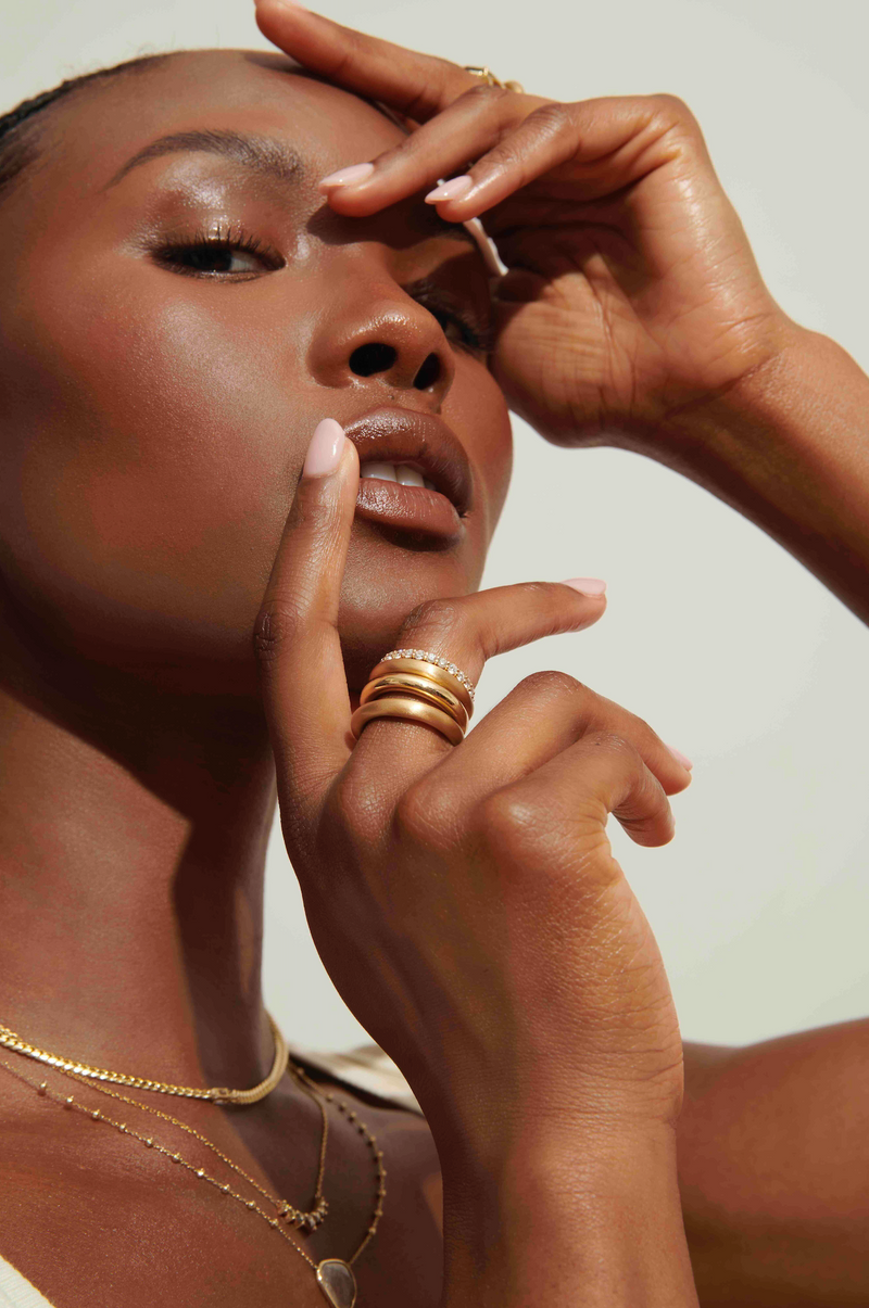 Model wearing a stack of rings, including the Vale Jewelry Allie Ring