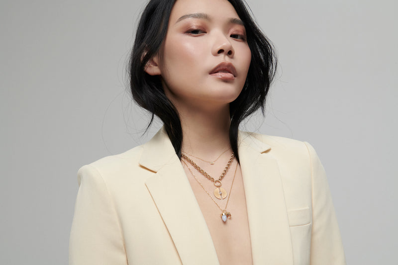 Model Wearing Amphora Amulet with Clear Quartz Charm from Vale Jewelry