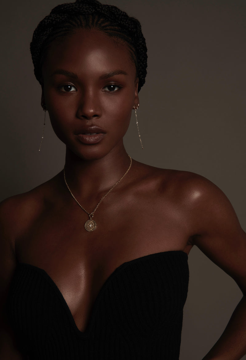 Model Wearing Round Disc Callie Necklace with Black and White Diamonds with Long Chain Diamond Earrings from Vale Jewelry