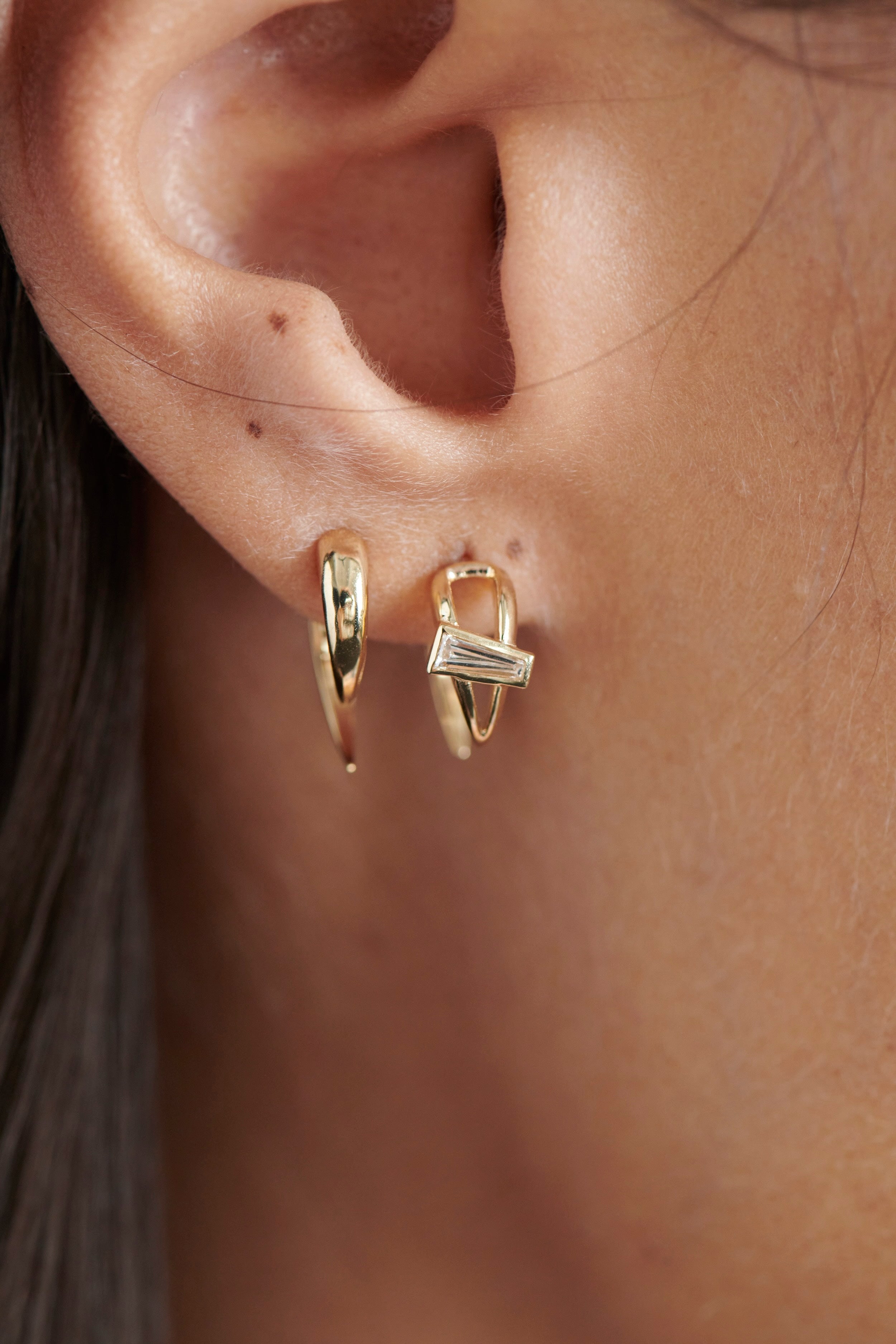 Close-up of Model Wearing Vale Jewelry Open Swoop Tapered Baguette Cut Diamond 2-Piece Earrings