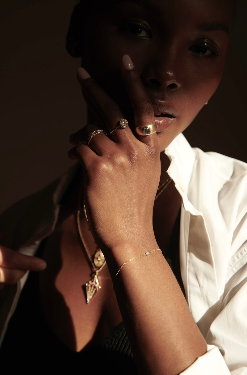 Model Wearing Origins Bracelet in Sunlight and Shadow from Vale Jewelry