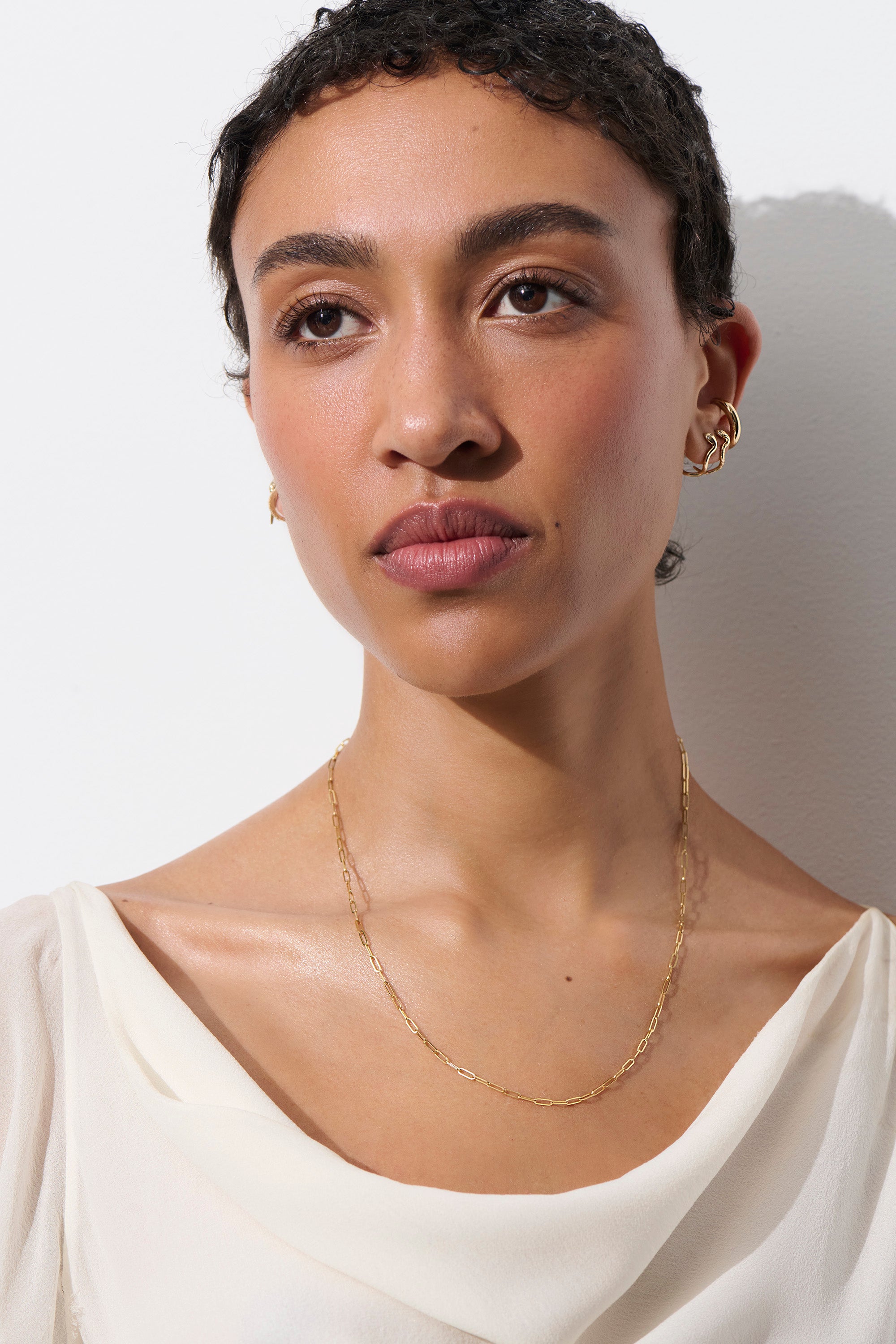 Model Wearing Vale Jewelry Paperclip Chain Necklace in Yellow Gold