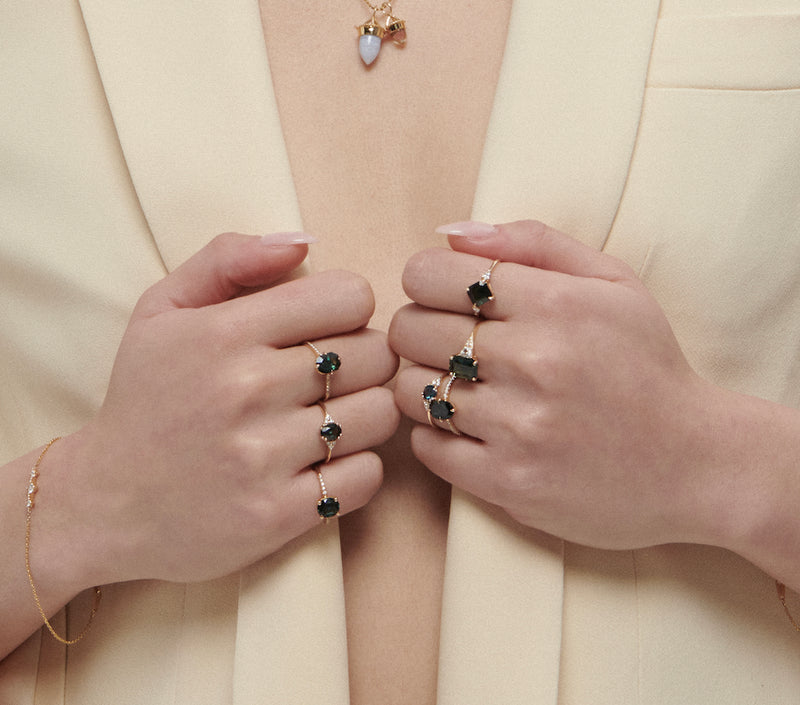 Model Wearing 7 Vale Jewelry Sapphire Rings Including Severine Ring, Alchemy Ring with Sapphire, Evelina Ring with Sapphire, Lune Ring with Sapphire, Fira Ring with Sapphire, Juno Ring with Sapphire, Hyeres Ring with Sapphire