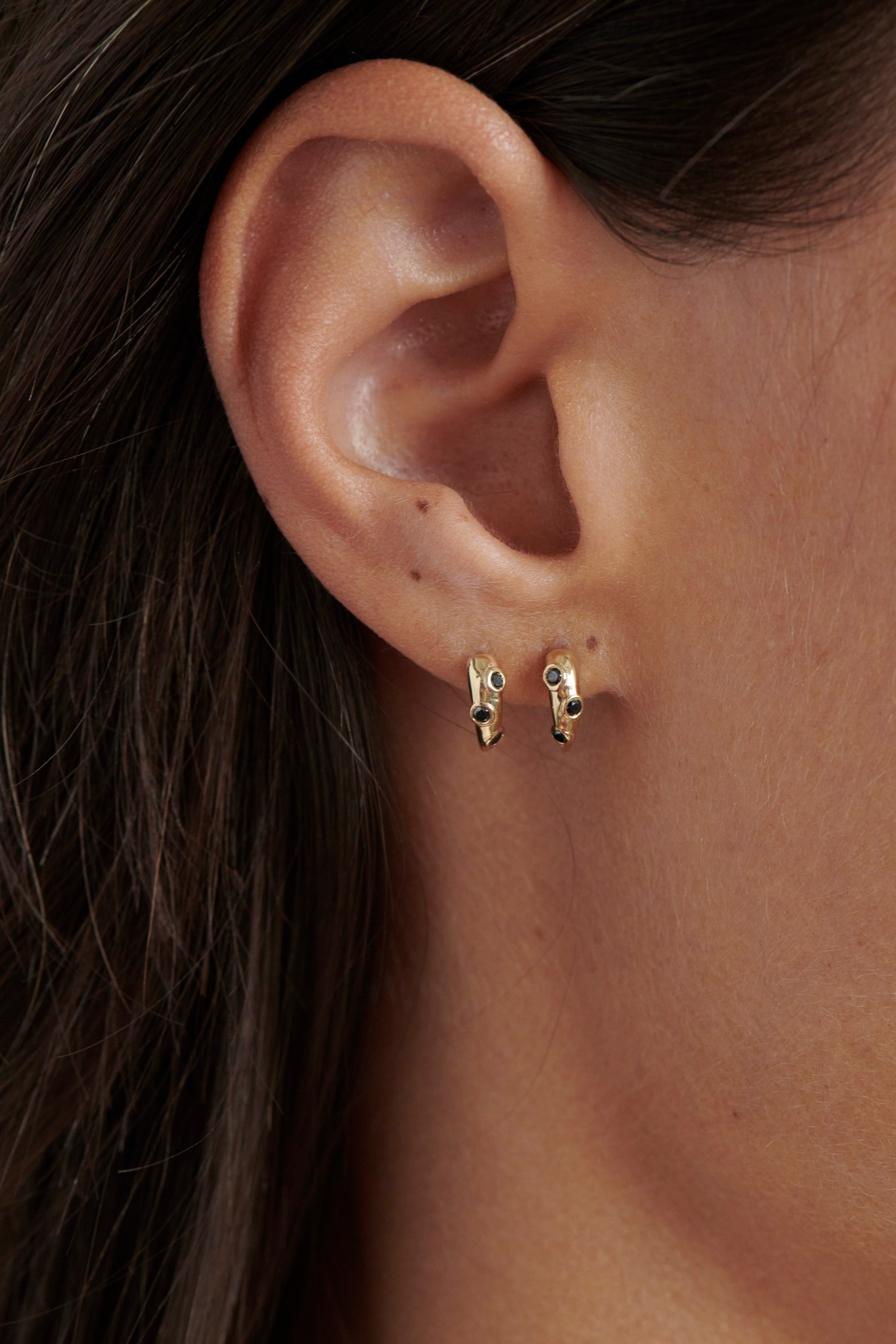 Close-up of Model Wearing Vale Jewelry Swoop Black Diamond 2-Piece Earrings