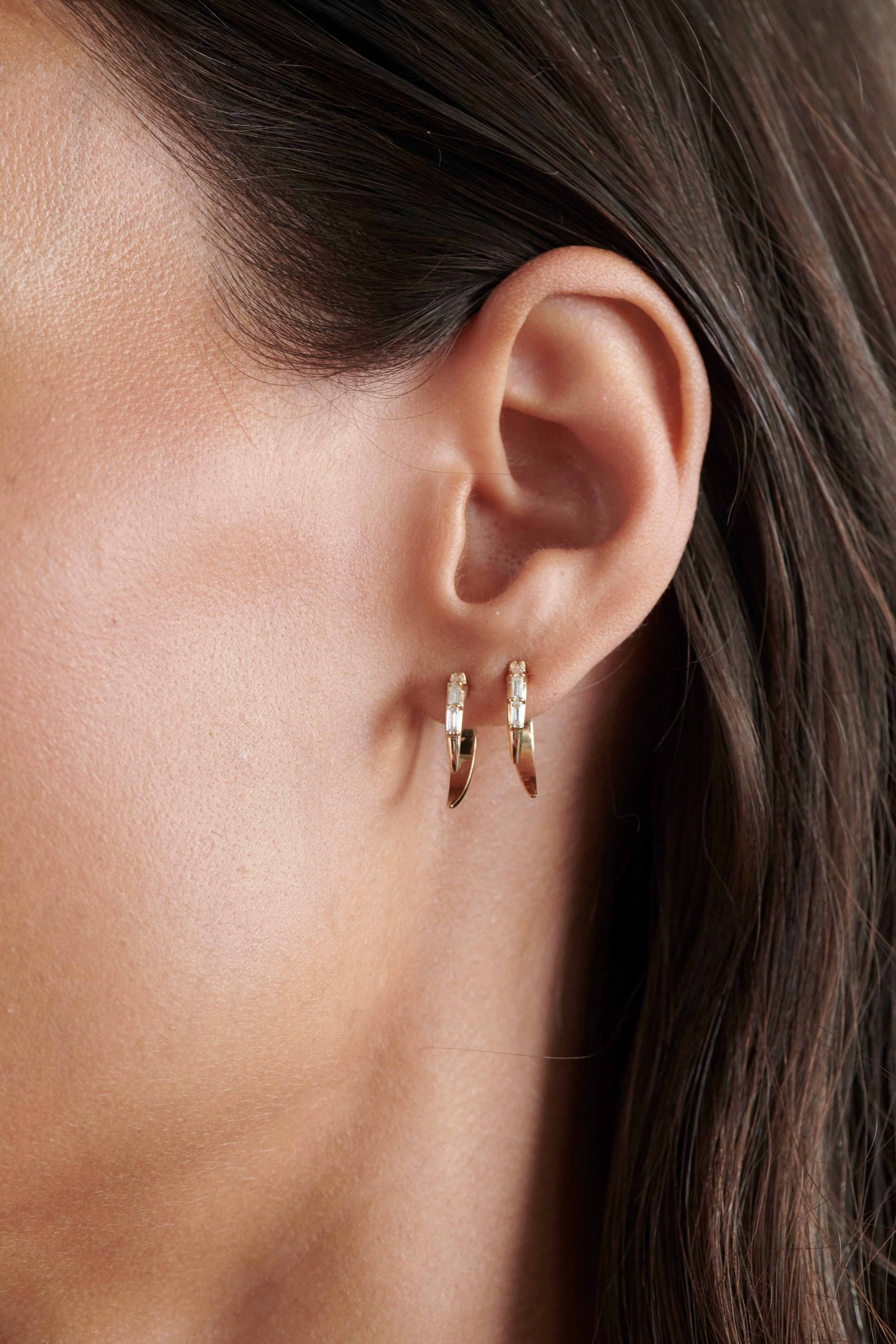Close-up of Model Wearing Vale Jewelry Swoop Baguette Cut Diamond 2-Piece Earrings