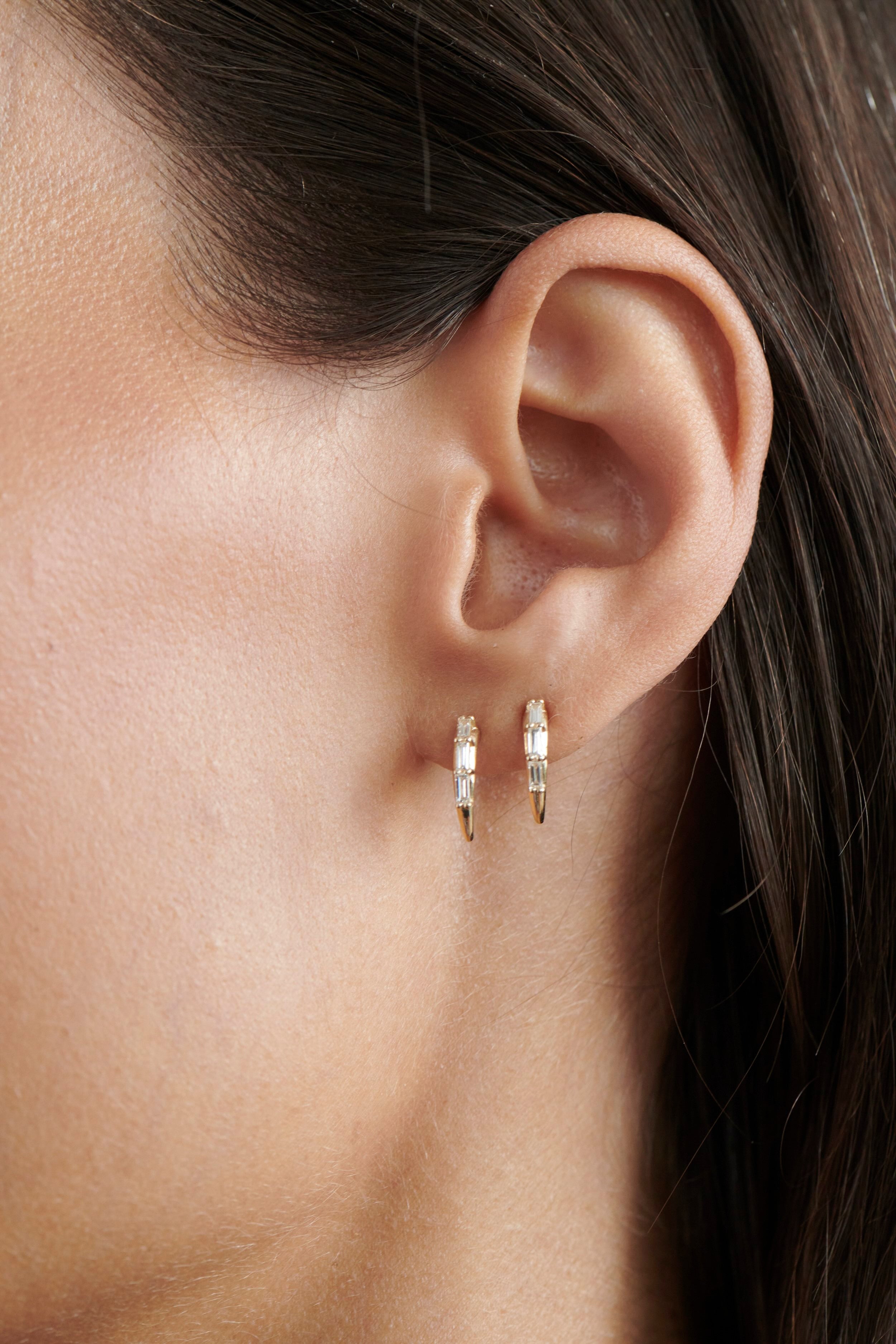 Close-up of Model Wearing Vale Jewelry Swoop Baguette Cut Diamond 2-Piece Earrings