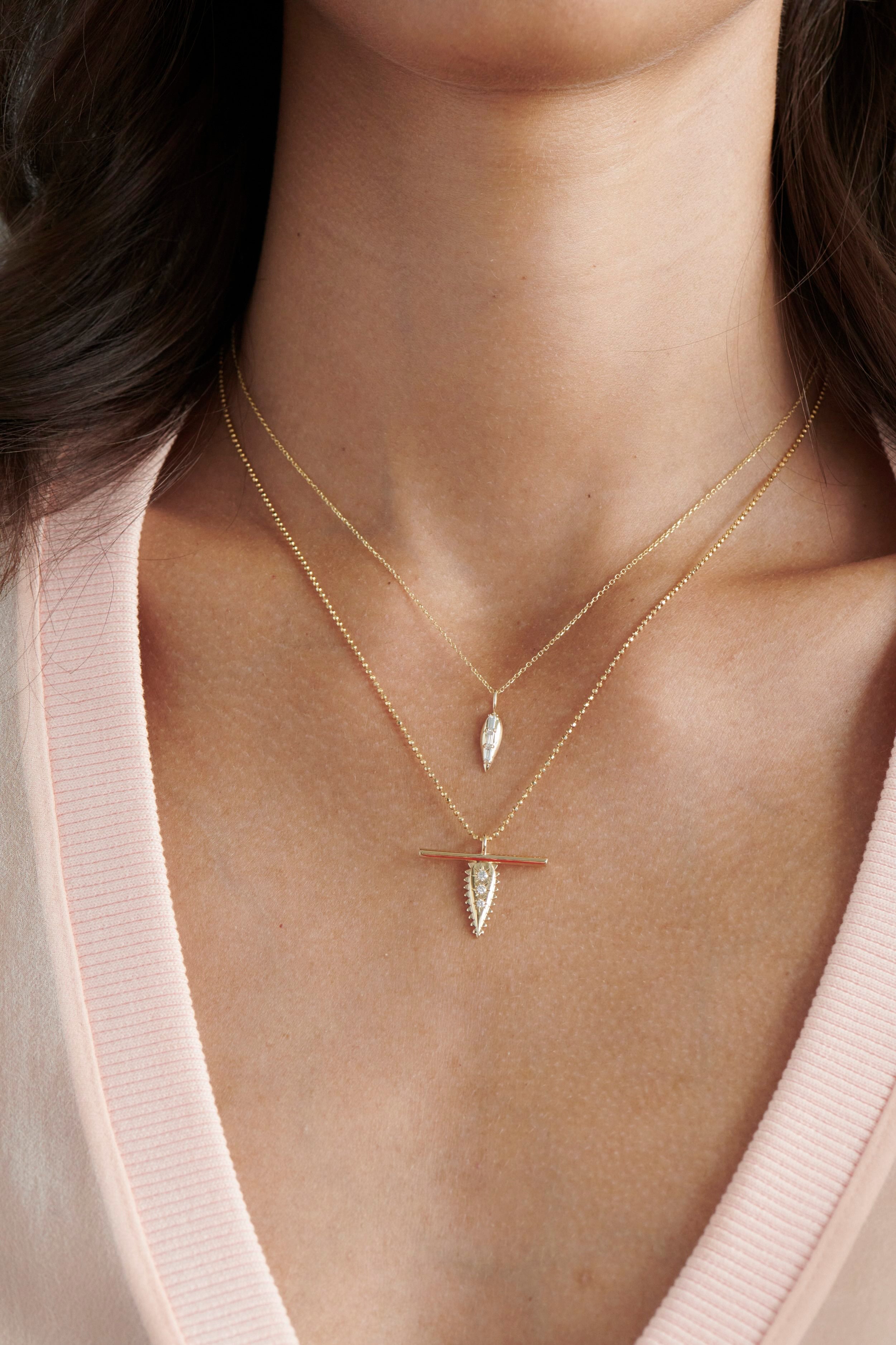 Close-up of Model Wearing Vale Jewelry Swoop Baguette Cut Diamond Necklace