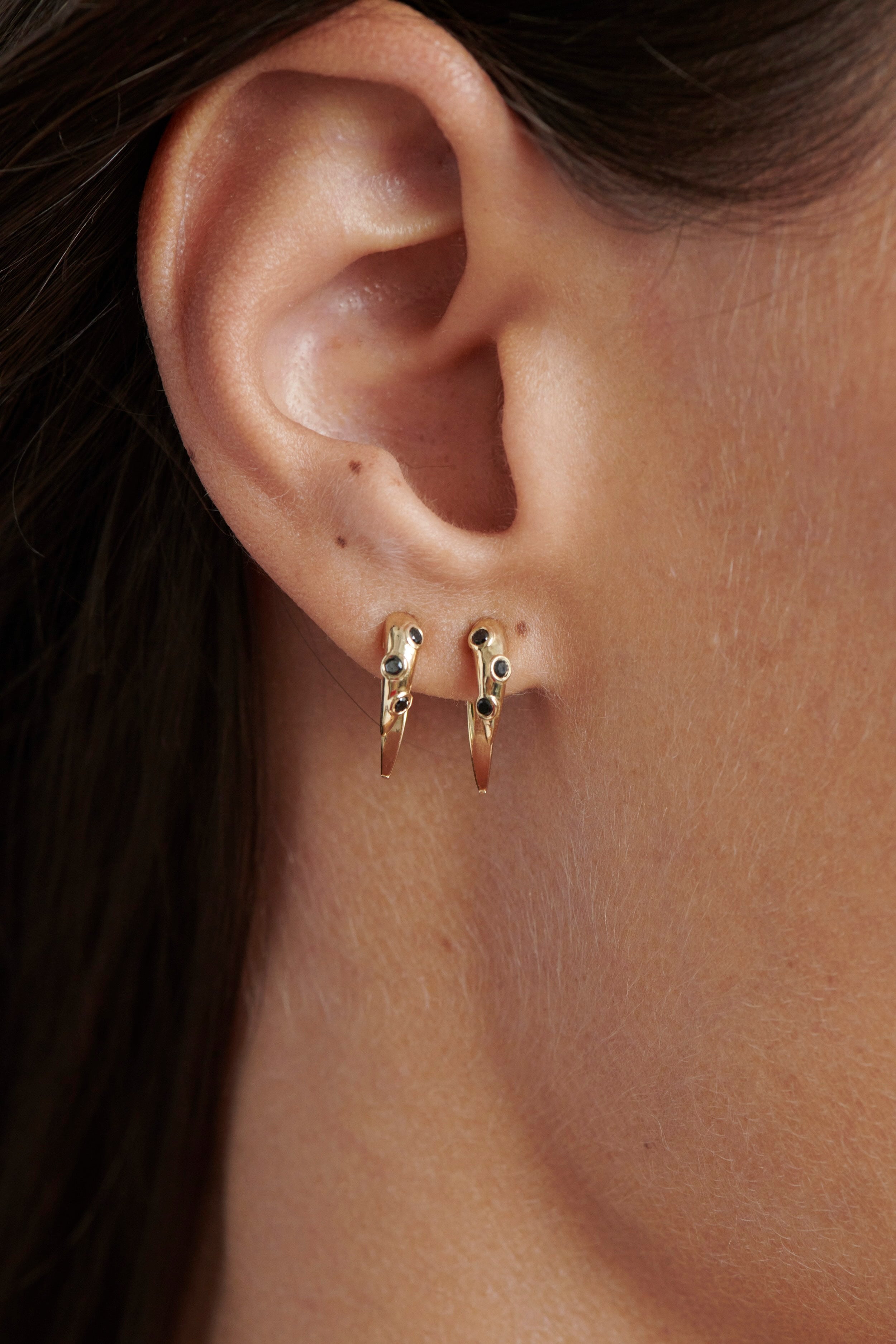 Close-up of Model Wearing Vale Jewelry Swoop Black Diamond 2-Piece Earrings