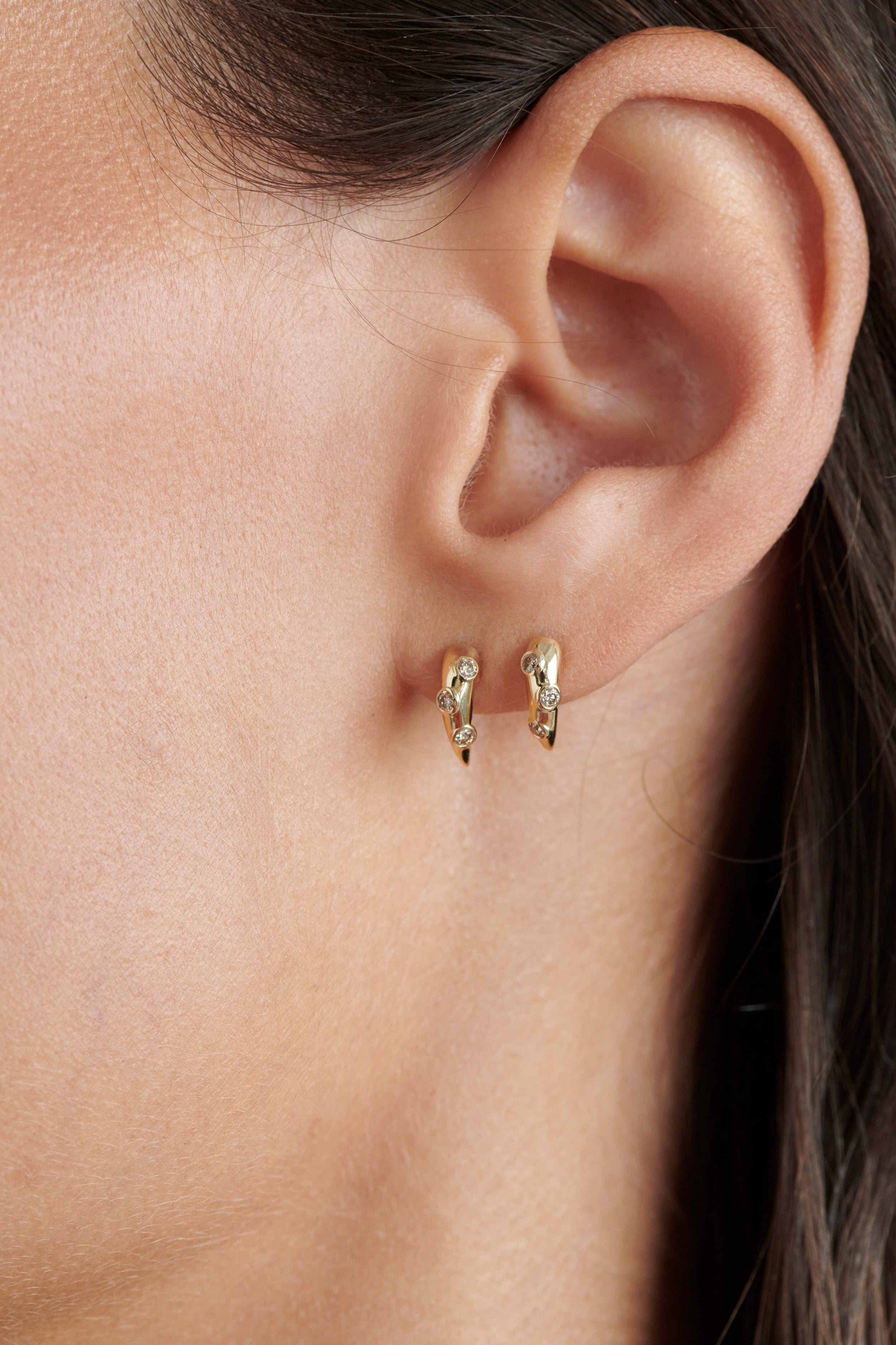 Close-up of Model Wearing Vale Jewelry Swoop Champagne Diamond 2-Piece Earrings