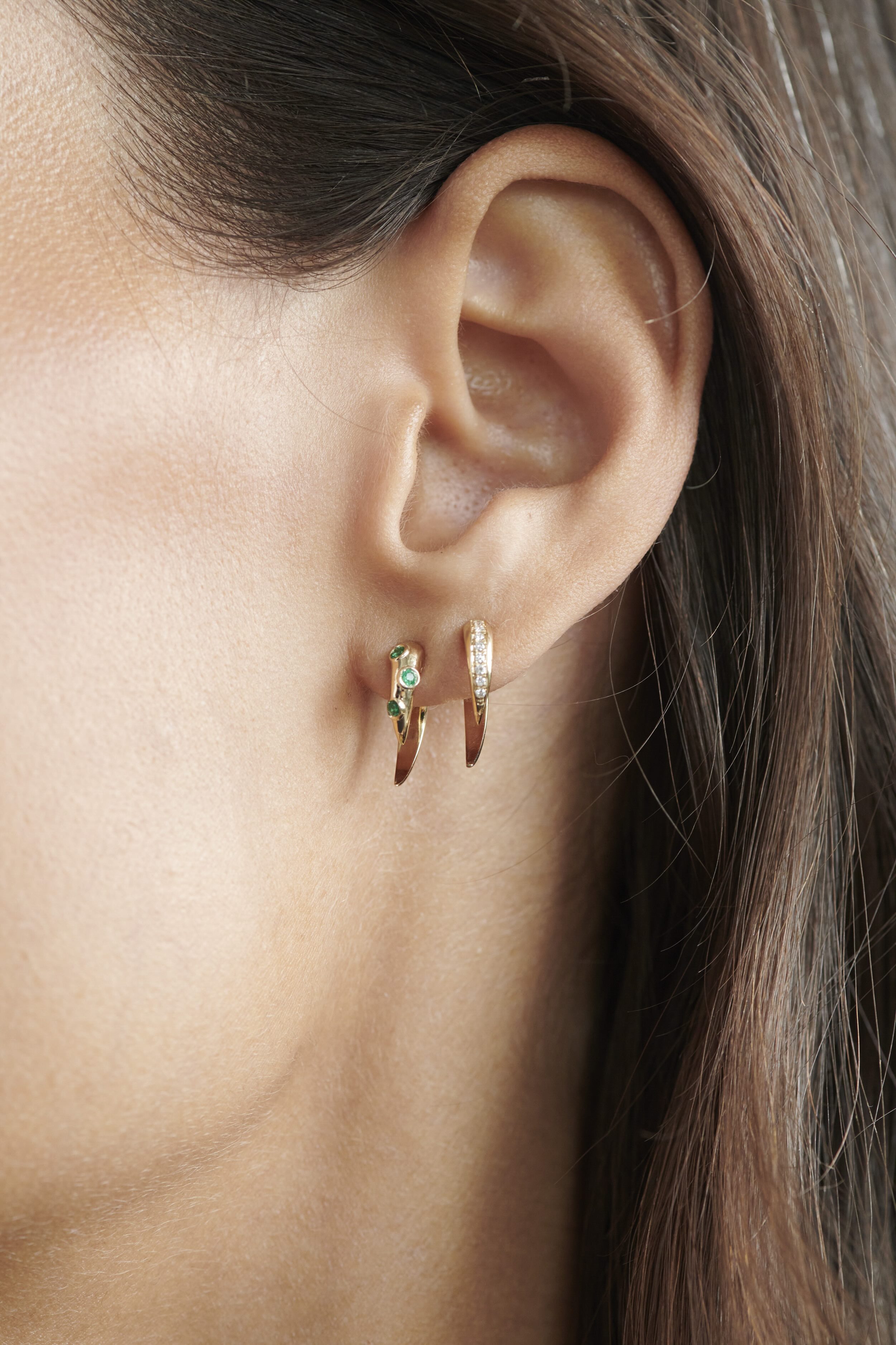 Close-up of Model Wearing Vale Jewelry Swoop Emerald 2-Piece Earrings