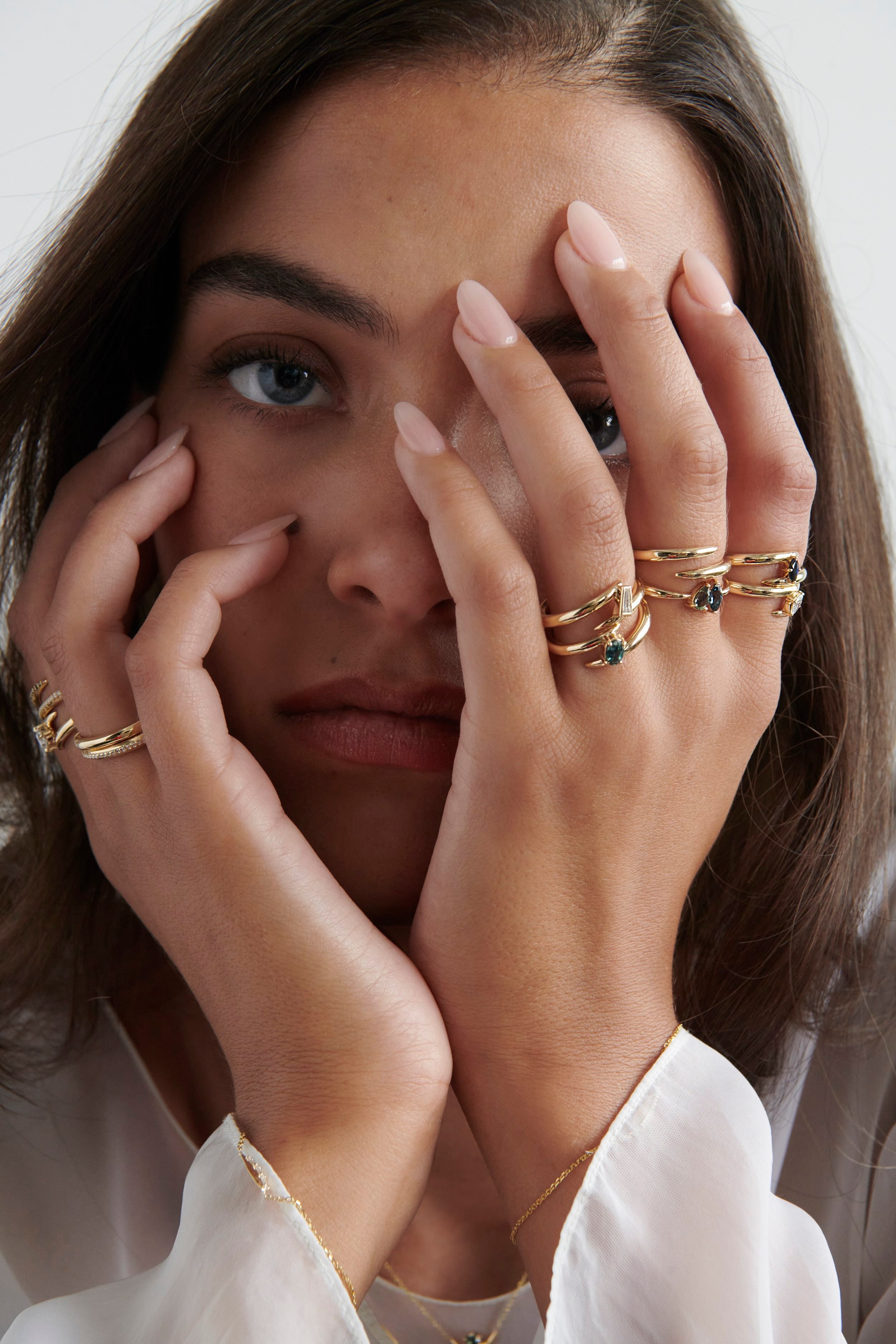 Close-up of Model Wearing Vale Jewelry Swoop Toi et Moi Sapphire Ring