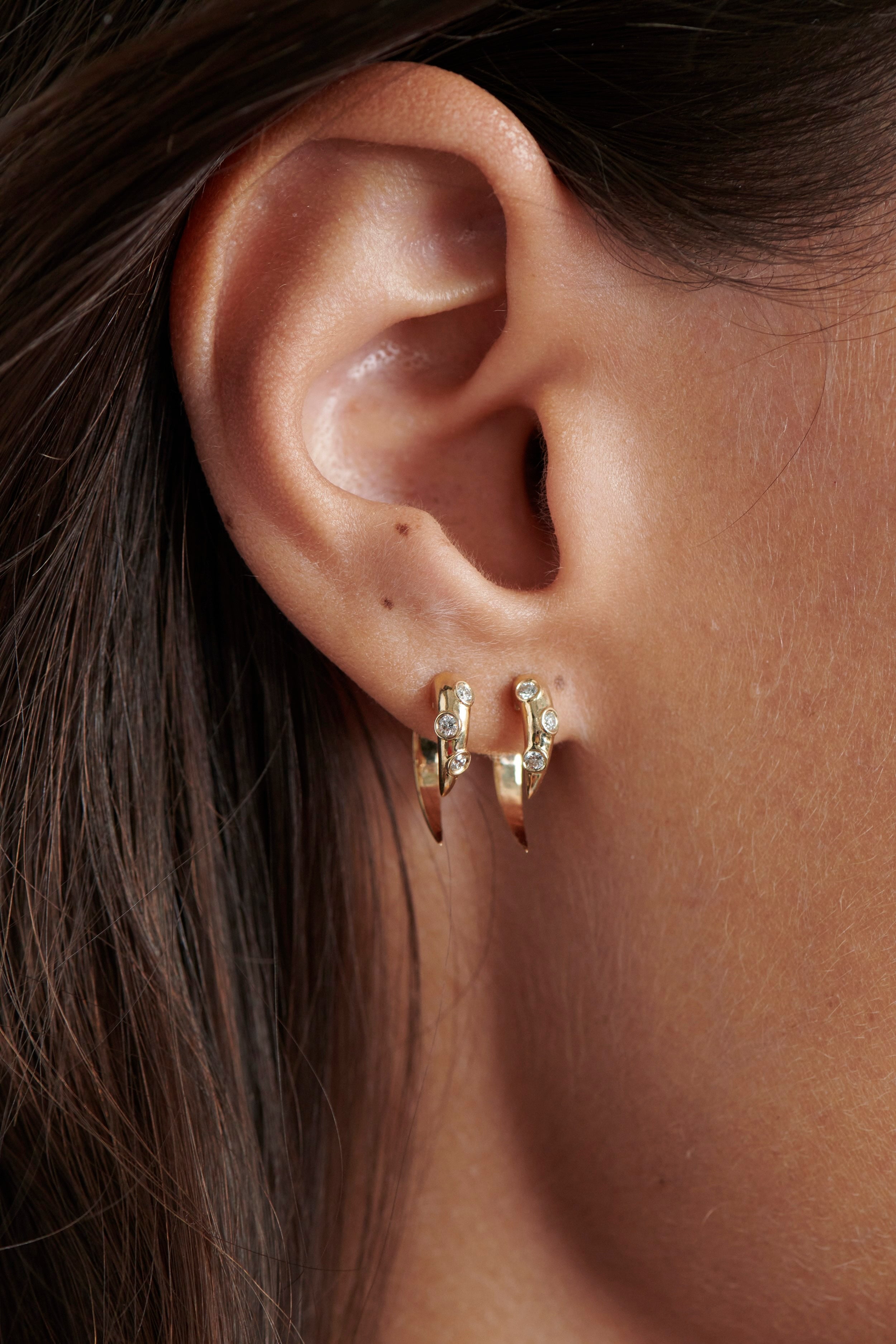 Close-up of Model Wearing Vale Jewelry Swoop White Diamond 2-Piece Earrings