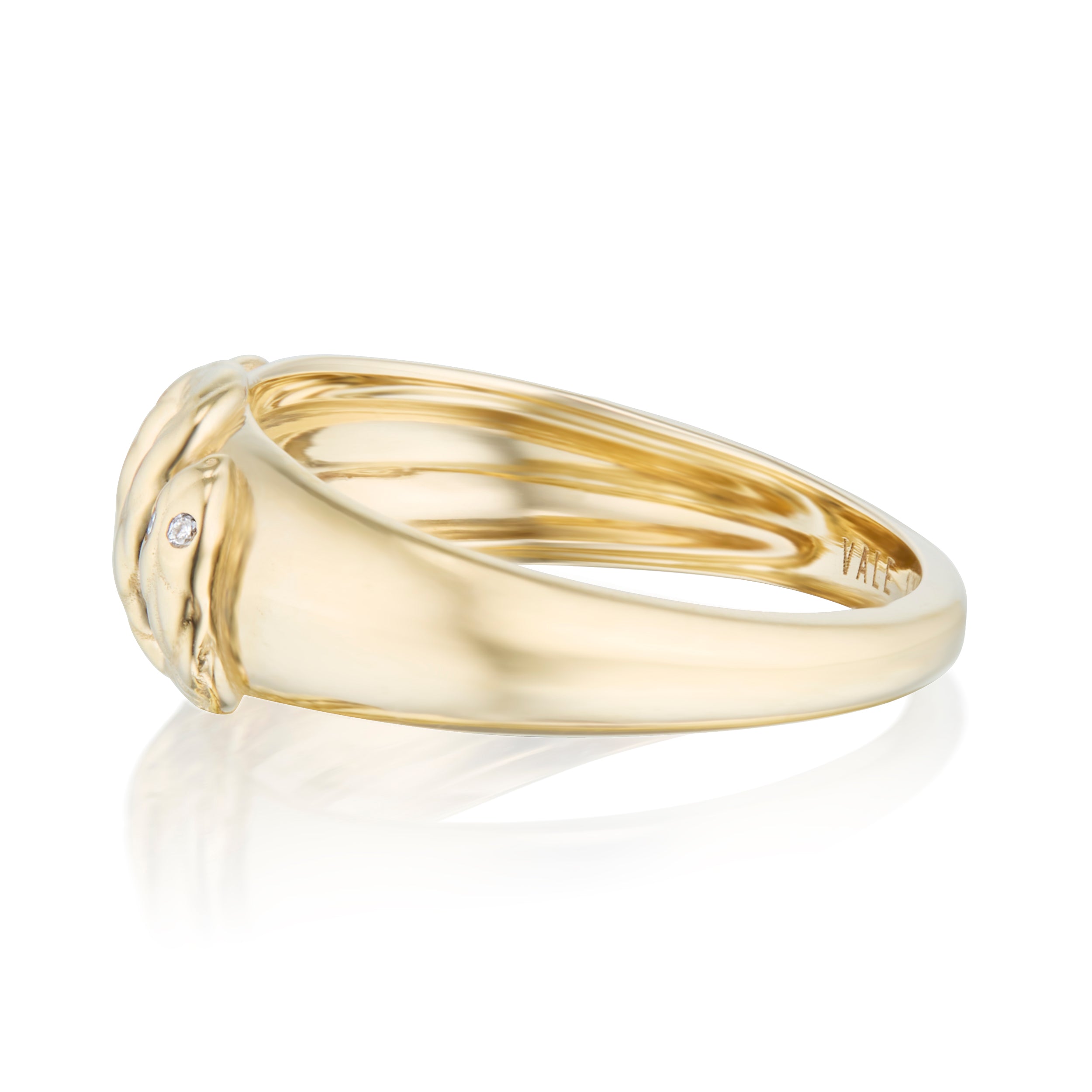 Gold dome ring with snake in profile on a white background
