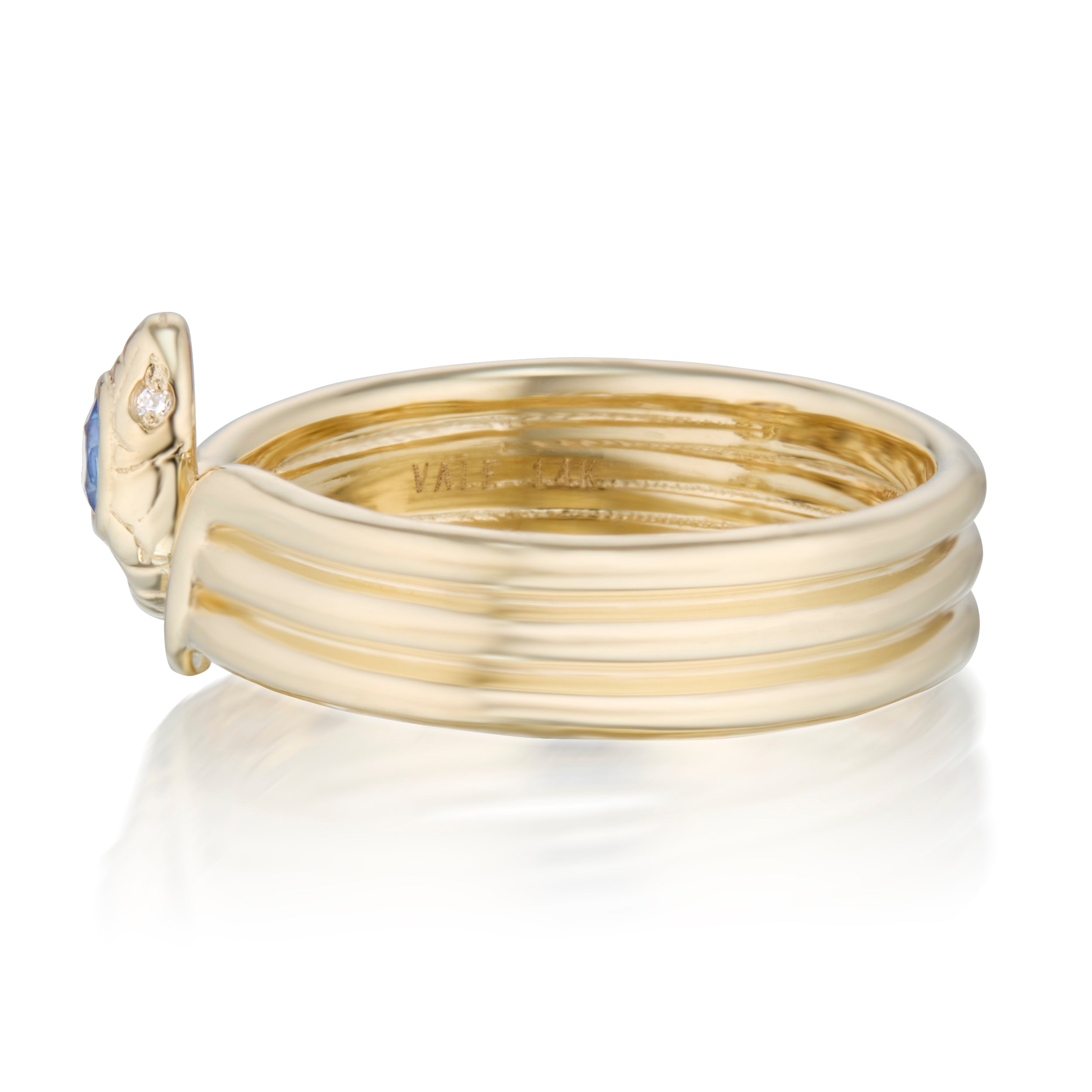 Side view of triple wrap snake ring with blue sapphire
