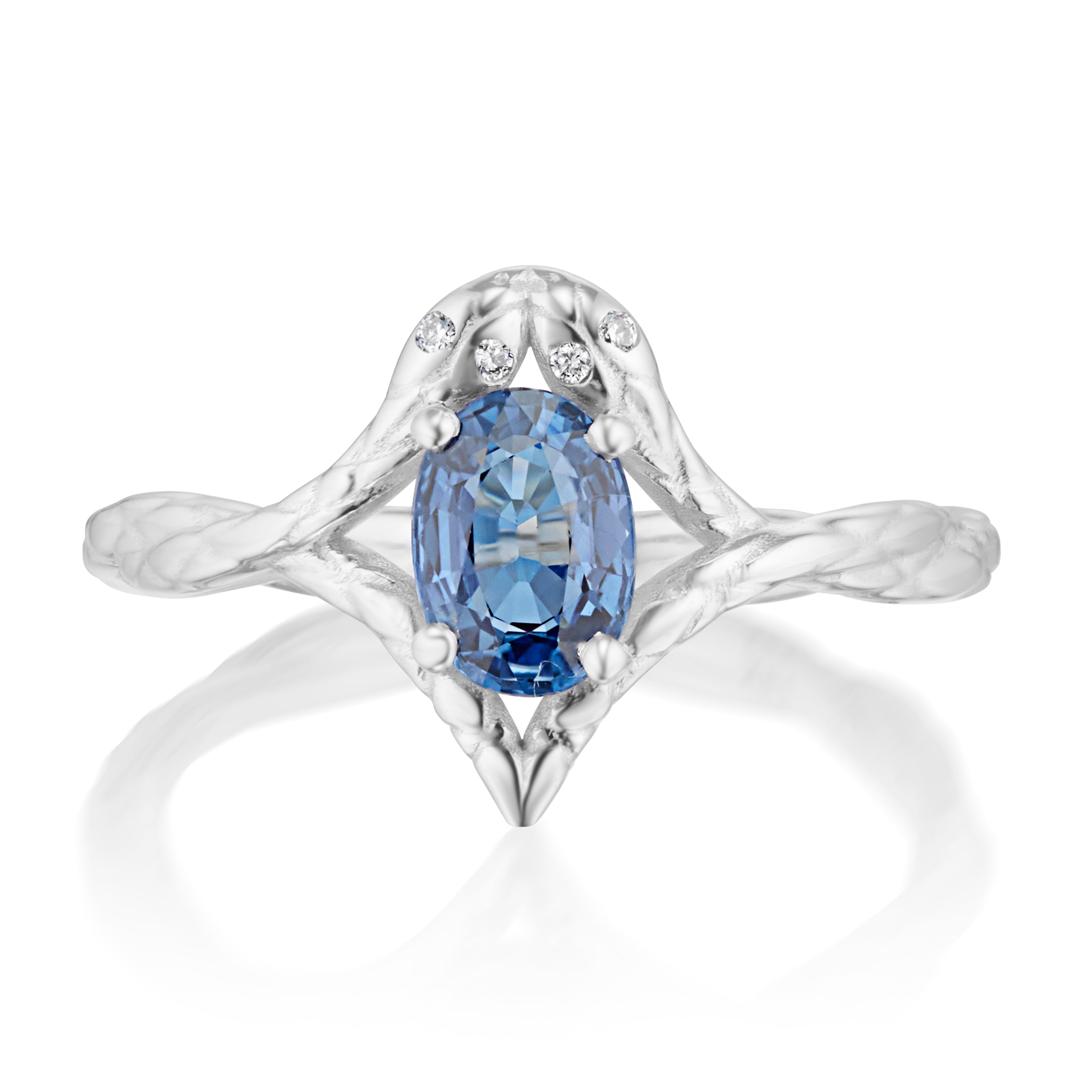 Alt="Vale Jewelry white gold ring with blue sapphire center stone and symmetrical snake motif?