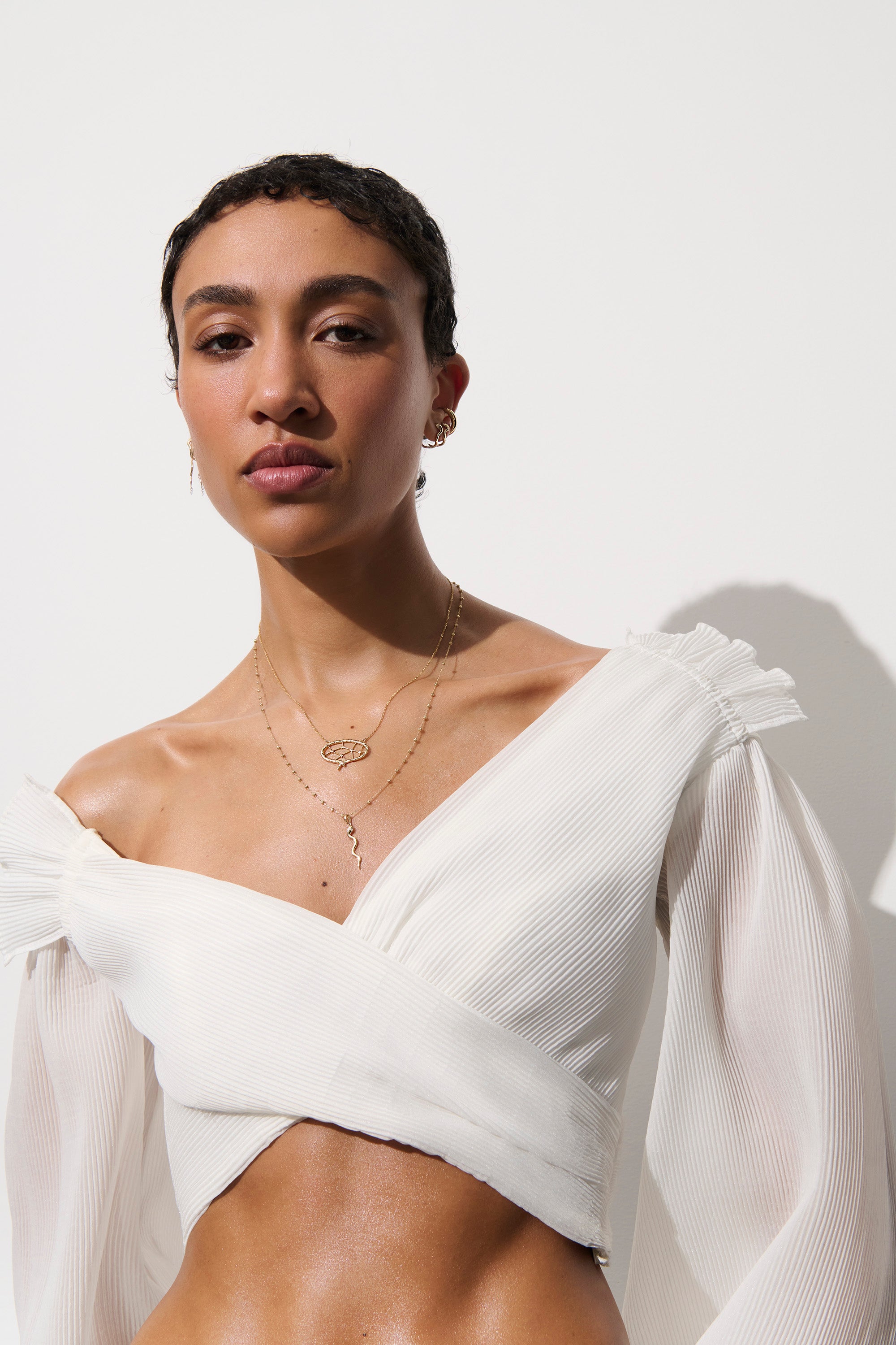 Alt="Vale Jewelry model wearing white top and web of stars necklace"