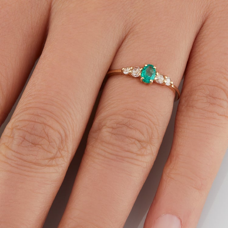 Vale Jewelry Bellatrix Oval Emerald Ring with White Rose Cut Diamond Accents in 14 Karat Yellow Gold Hand View
