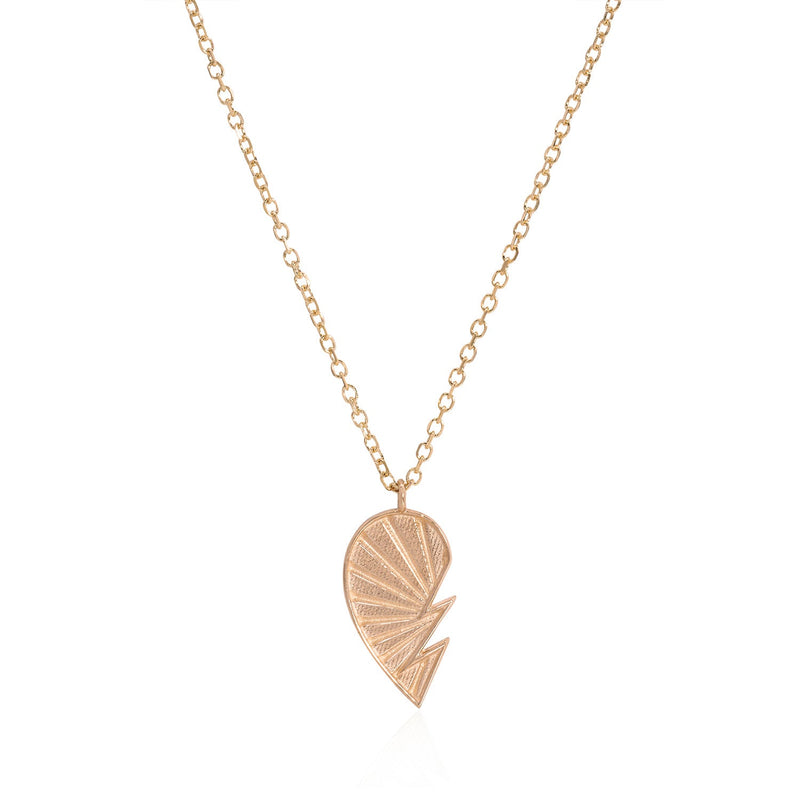 Vale Jewelry Love You To Pieces Heart Necklace on Diamond Cut Cable Chain Left Lobe in 14 Karat Rose Gold Close Up